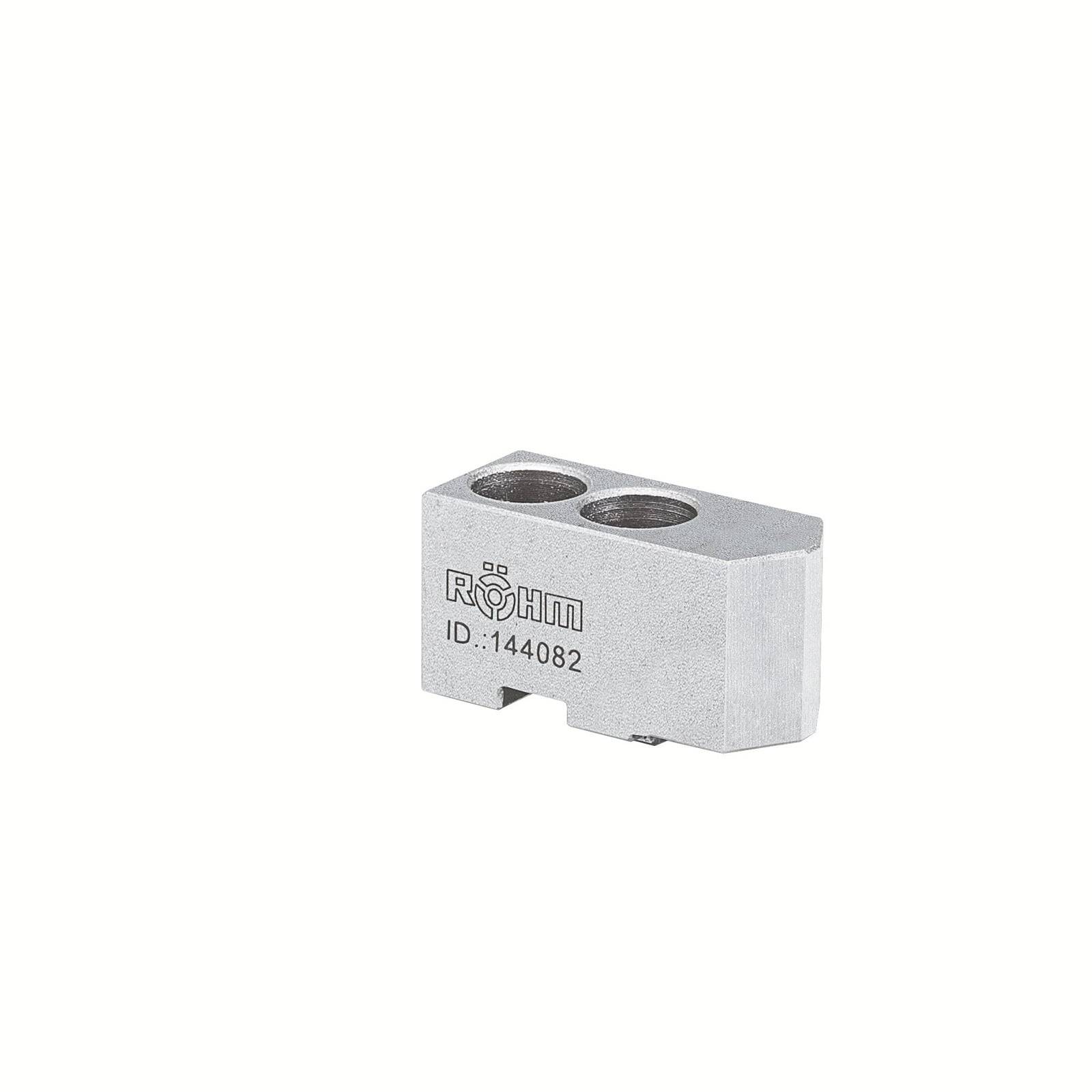 Ein Metallblock der Marke Röhm mit der Prägung 