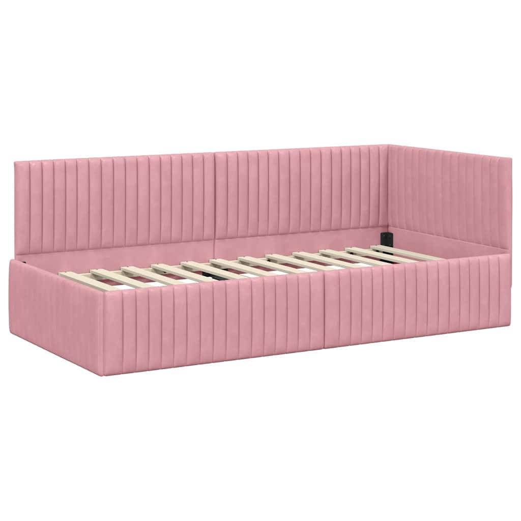 Ein rosa gepolstertes Ecksofa-Tagesbett mit sichtbaren Holzlatten, entworfen für die Verwendung im Wohnzimmer oder Schlafzimmer.