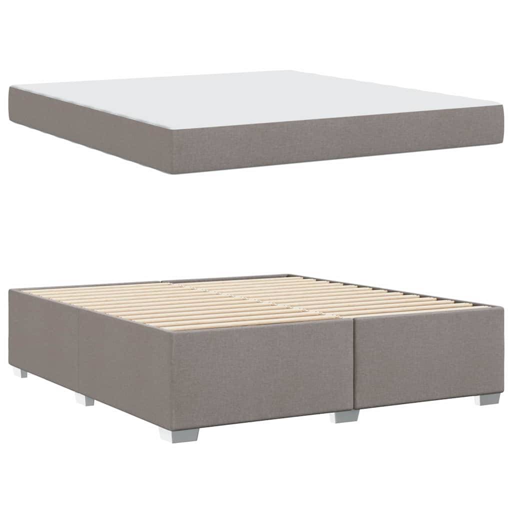 Queen-Size-Plattformbett mit einer grau gepolsterten Basis und Holzlatten zur Matratzenunterstützung, ohne Matratze dargestellt.
