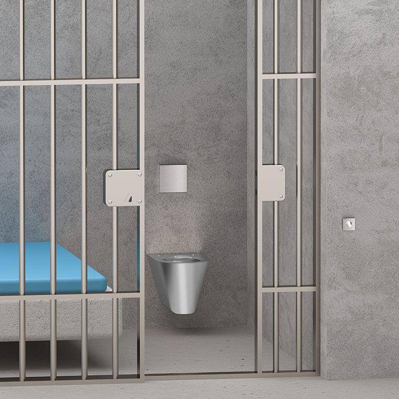 Gefängniszelleinnenraum mit Metallstäben, einem blauen Bett und einer an der Wand montierten Edelstahl-Toiletten-Waschbecken-Kombination.