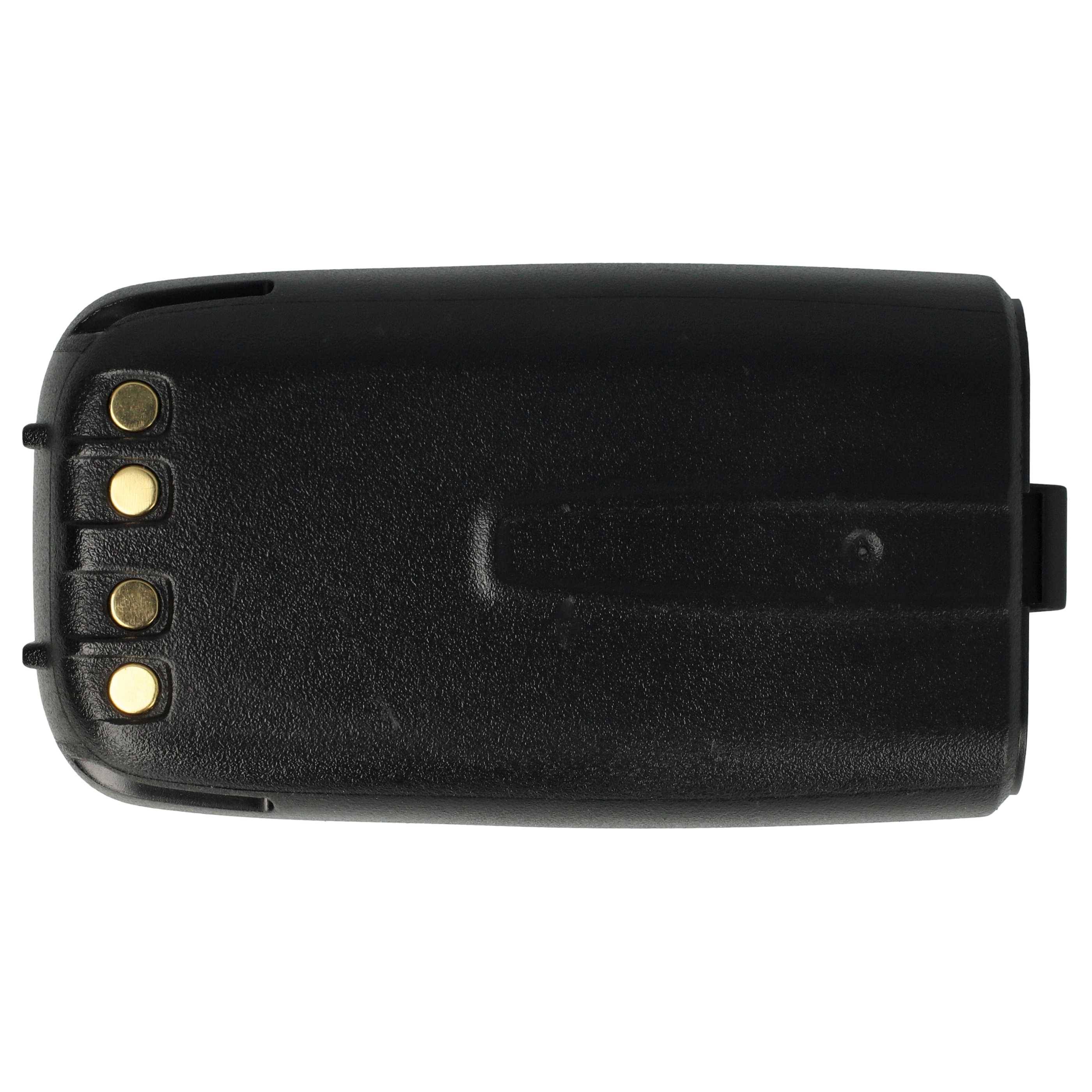 Eine schwarze, rechteckige Batteriebox mit drei goldenen Kontaktpunkten an einem Ende, von oben betrachtet.