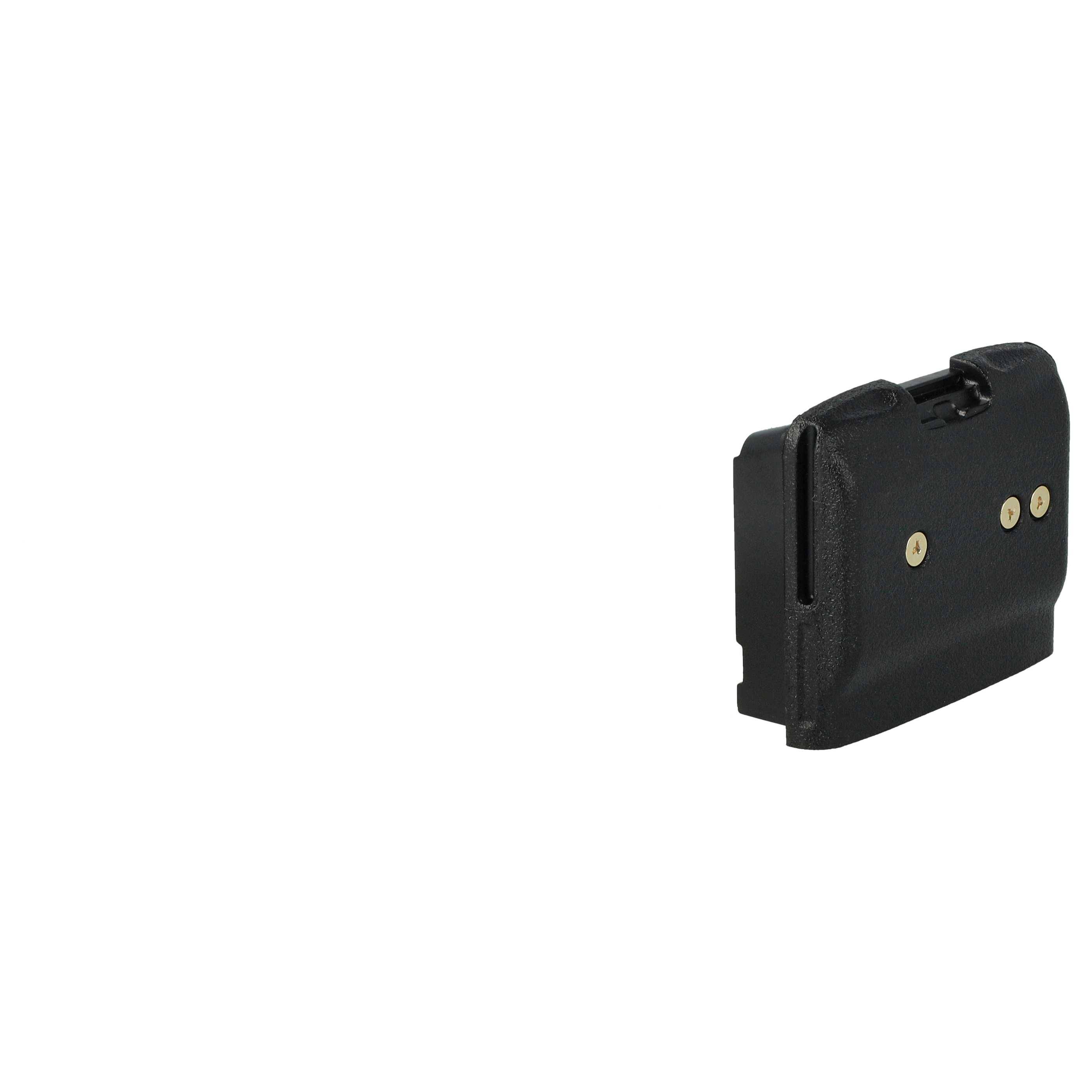 Ein kleines, schwarzes Plastikgerät mit zwei goldenen Kontaktpunkten auf einer Seite, vor einem schlichten weißen Hintergrund.
