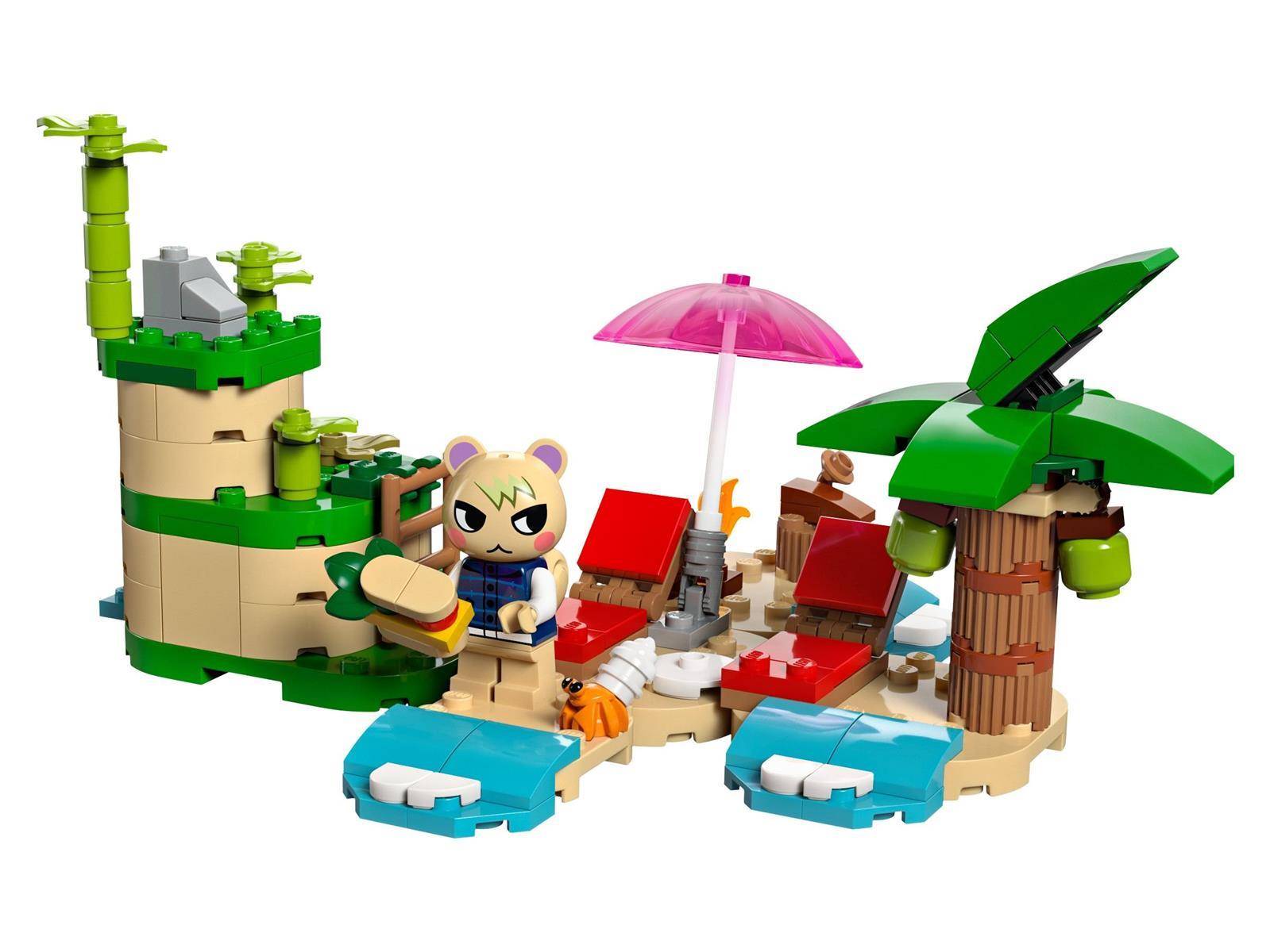 LEGO-ähnliche Strandszene mit einer kleinen Tierfigur, Palmen, Liegestühlen, Sonnenschirm, Surfbrettern und türkisblauem Wasser auf einer sandigen Insel.