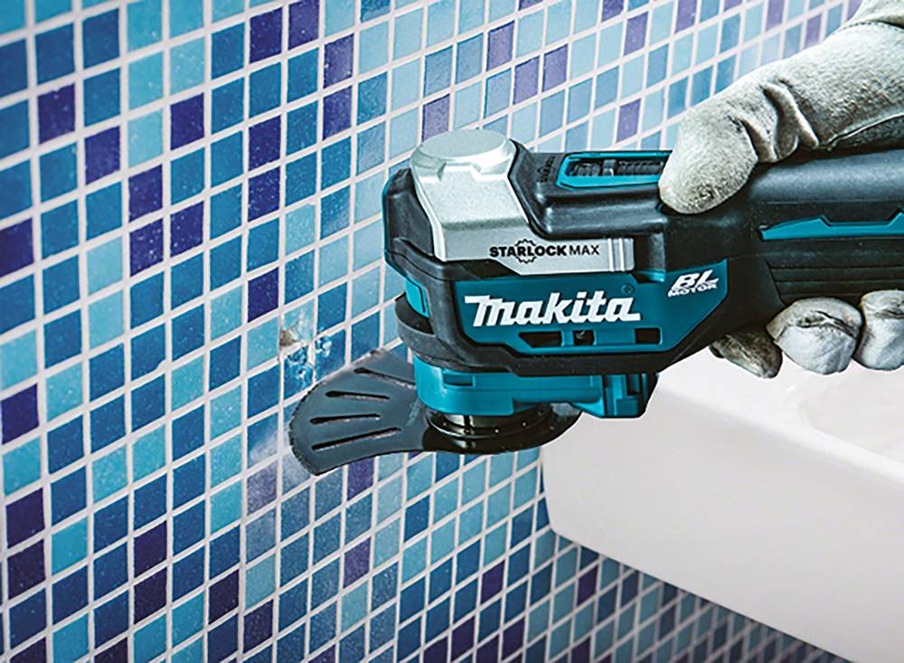 Makita Akku-Multifunktionswerkzeug 18V Multitool DTM52RF1 + Akku + DC18RC