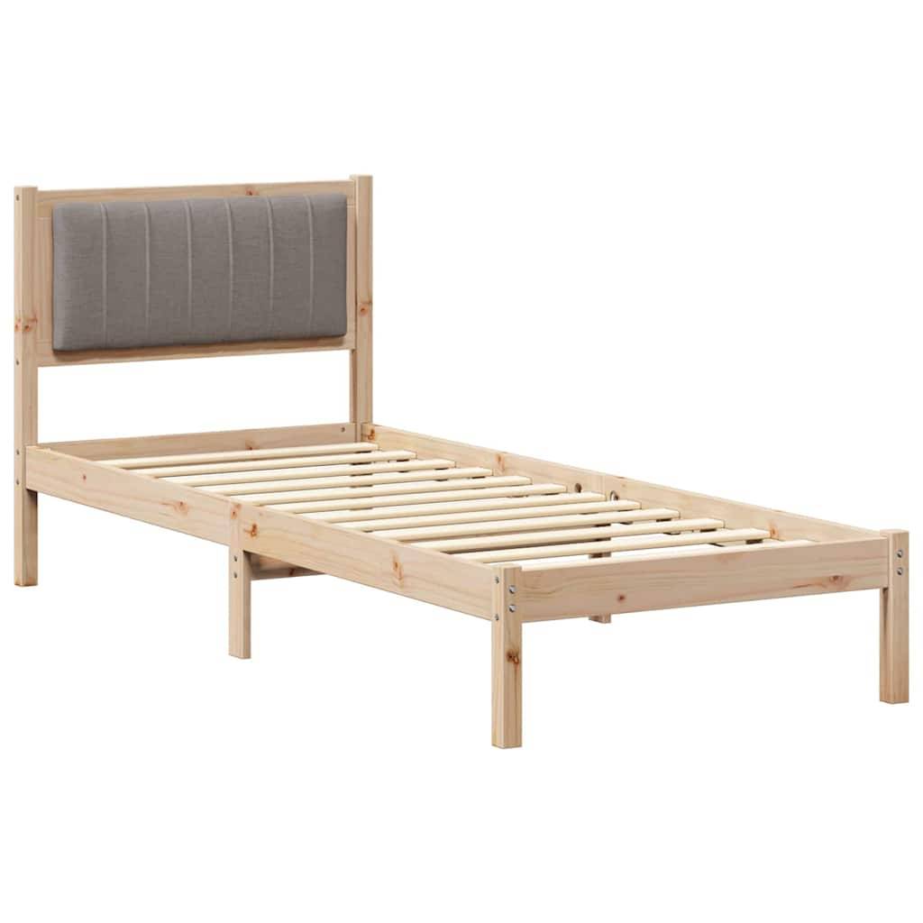 Ein Holz-Einzelbettgestell mit Lattenrost und gepolstertem, gepolstertem Kopfteil.