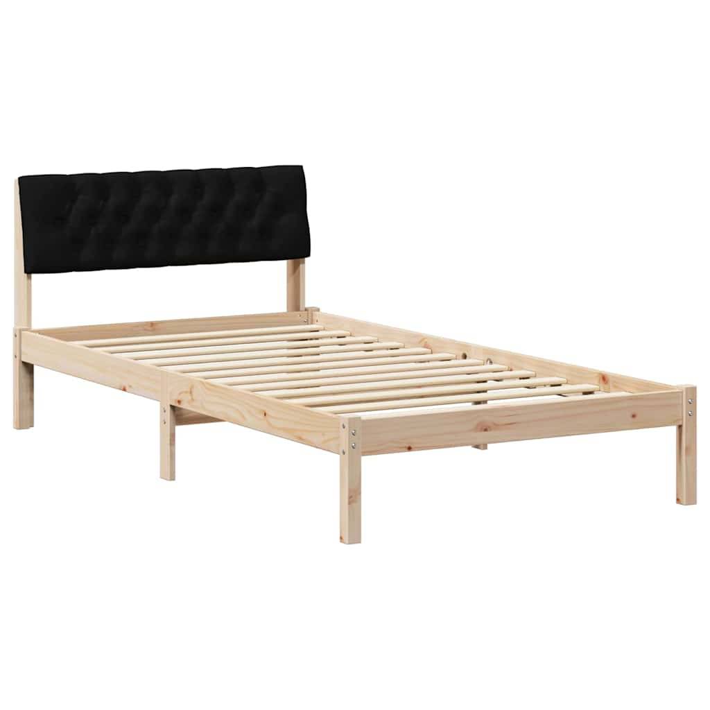 Ein Holzbettgestell mit einem schwarzen, gesteppten Kopfteil, ohne Matratze, das seinen Rahmen und die Lamellenunterlage zeigt.