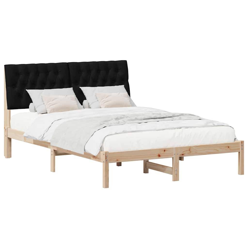 Ein Holzbettgestell mit einem schwarzen gepolsterten Kopfteil. Es ist mit weißer Bettwäsche und zwei Kissen ausgestattet.