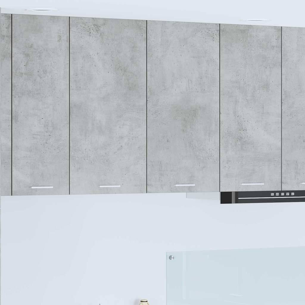 Eine moderne Küche mit hellgrauen Schränken und einem schlichten, minimalistischen Design, das sich auf dezente, klare Linien konzentriert.