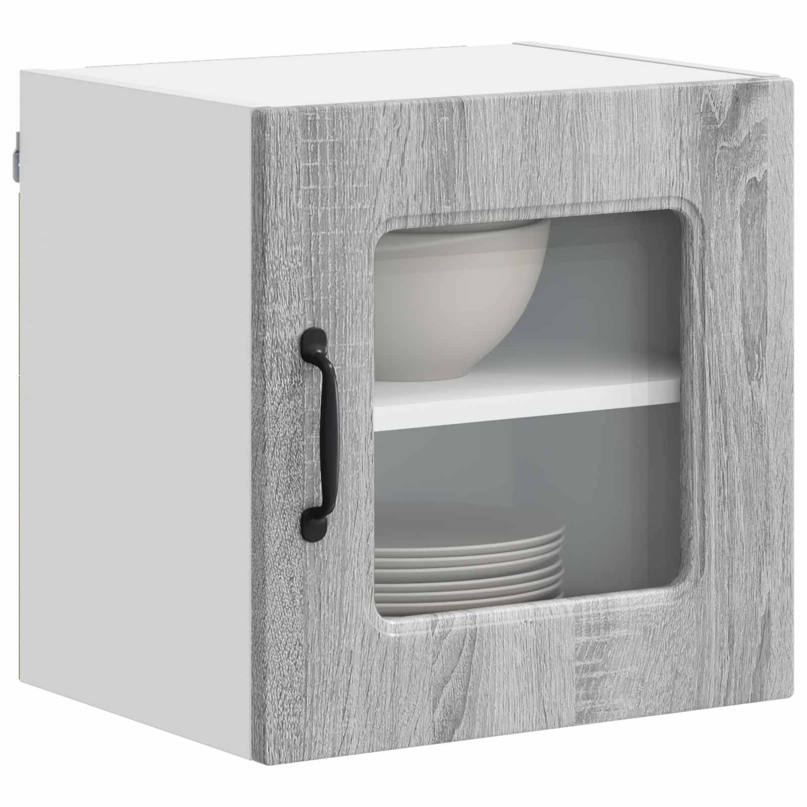 Ein grauer, holzmaserierter Wandschrank mit einer Glastür, versehen mit einem schwarzen Griff. Im Inneren sind eine Schüssel und Teller ordentlich auf einem Regal angeordnet.