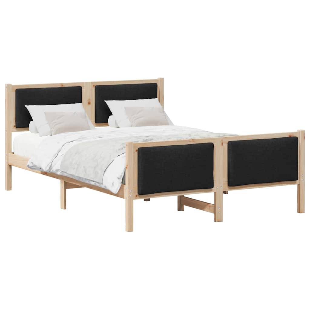 Ein Holz-Einzelbett mit schwarzen gepolsterten Kopf- und Fußteilen, ausgestattet mit weißer Bettwäsche und zwei Kissen.