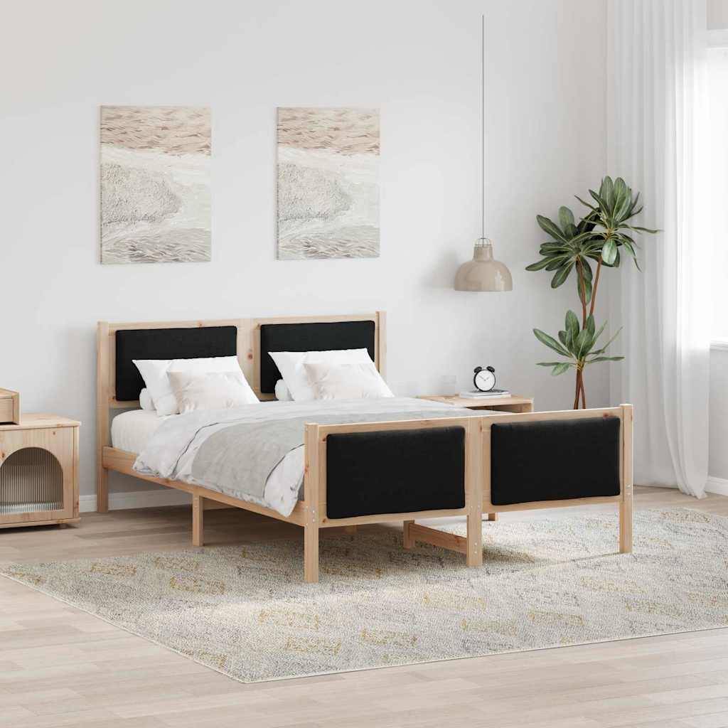 Ein modernes Schlafzimmer zeigt ein Holzbett mit schwarzen Akzenten, zwei Landschaftsgemälde darüber, eine große Zimmerpflanze und einen Nachttisch.