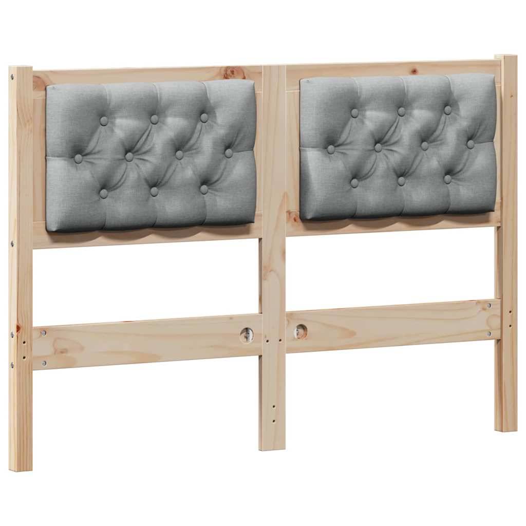 Ein Holzkopfteil mit zwei gepolsterten Stoffpaneelen in Grau, die daran befestigt sind.