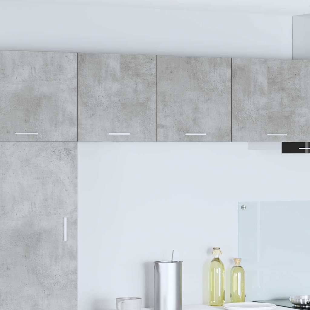 Graue Küchenschränke mit minimalem Design, mit einer weißen Arbeitsplatte, einer Edelstahlbecher und Olivenölflaschen für einen schlanken, modernen Look.