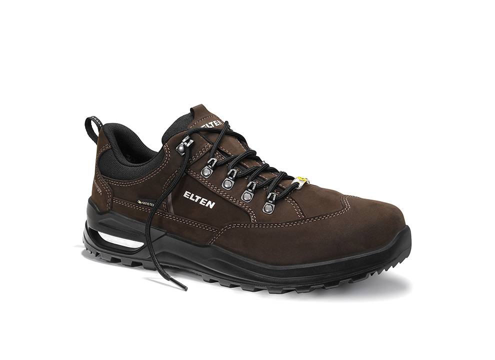 Ein brauner Wanderschuh mit schwarzen Schnürsenkeln und einer robusten Sohle, mit dem Markennamen 'Elten' an der Seite und verstärkter Zehenpartie für Langlebigkeit.