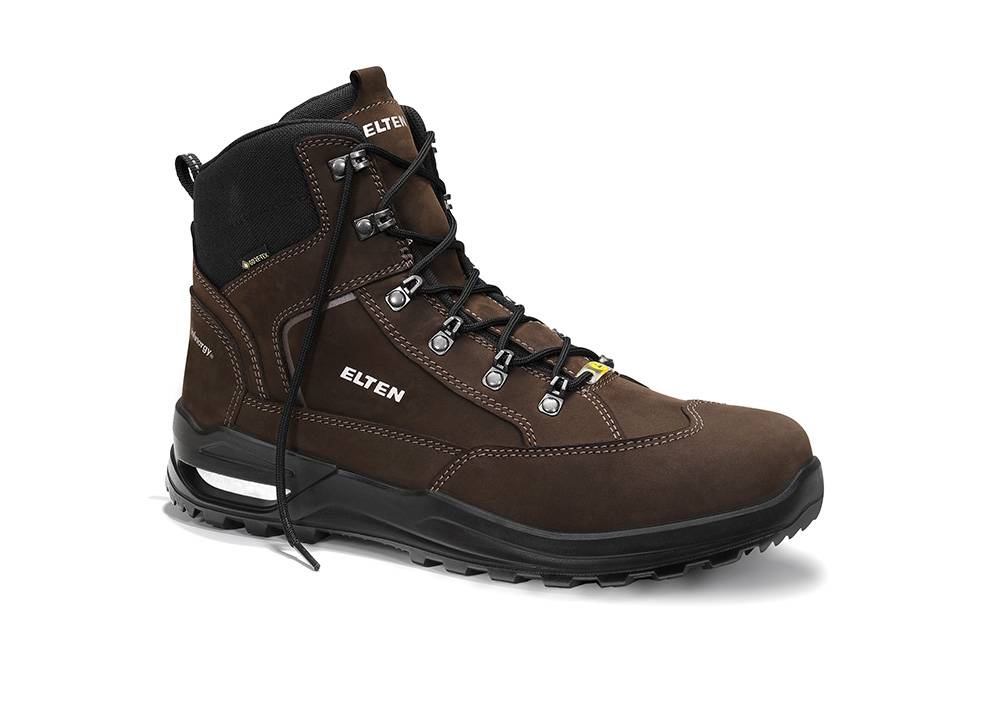 Brauner Lederwandersstiefel mit schwarzer Gummisohle, mit der Aufschrift 'Elten'. Ausgestattet mit Metalldurchführungen und gepolsterter Knöchelunterstützung für Haltbarkeit.
