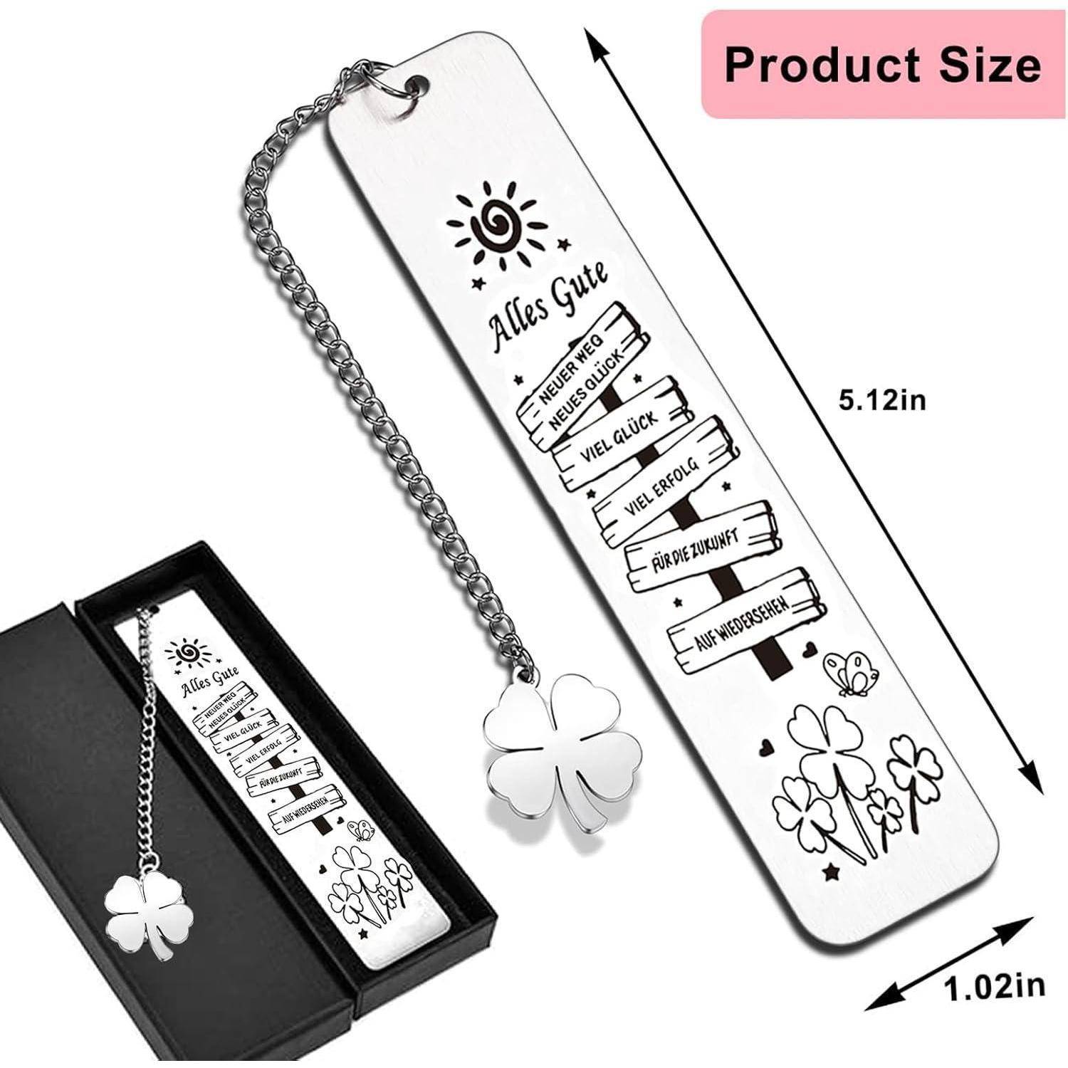 Metall-Lesezeichen mit Kette und Kleeblattdesign, versehen mit besten Wünschen auf Deutsch. Kommt in einer schwarzen Box.