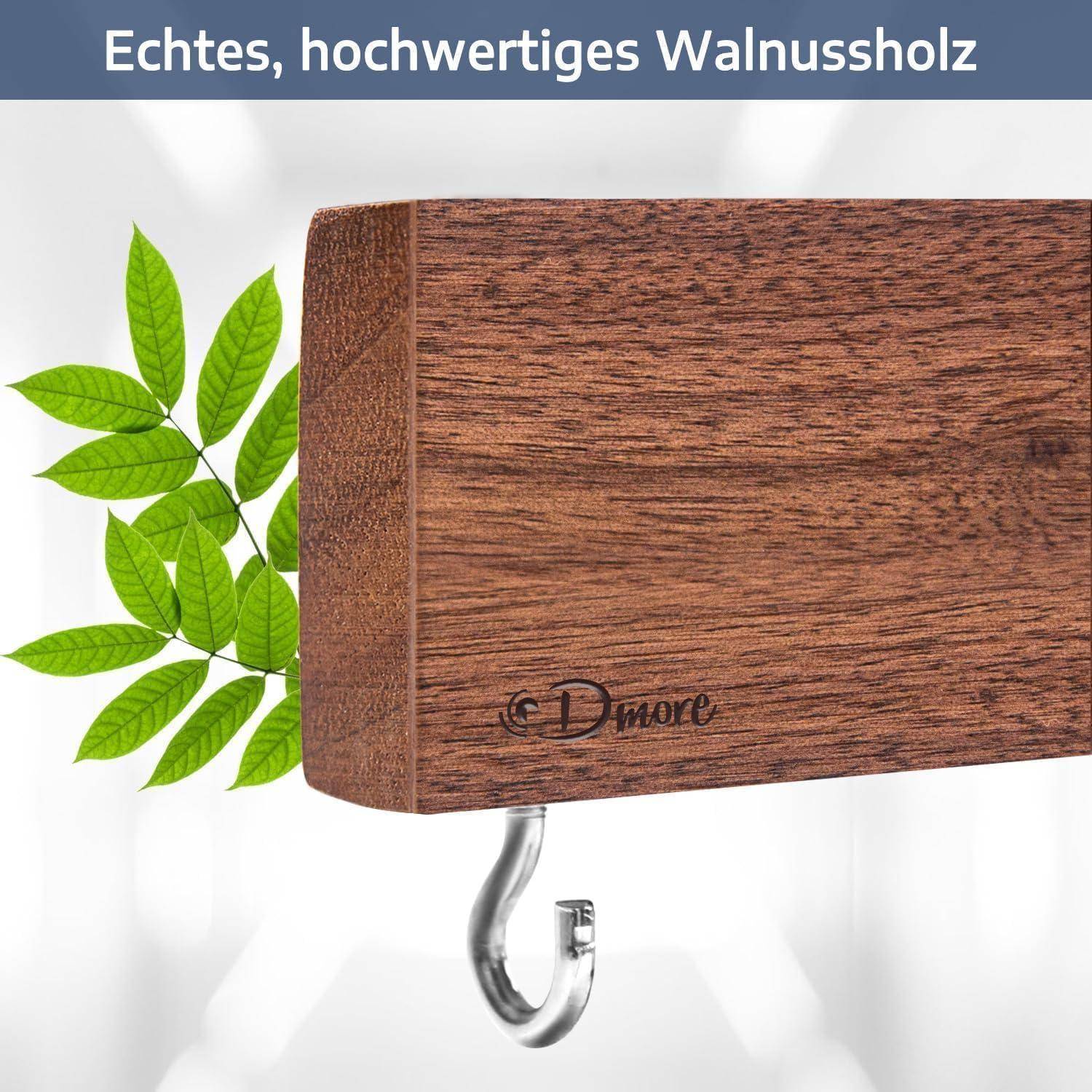 Ein Holzblock mit einem Haken wird gezeigt. Text in deutscher Sprache oben liest sich: 