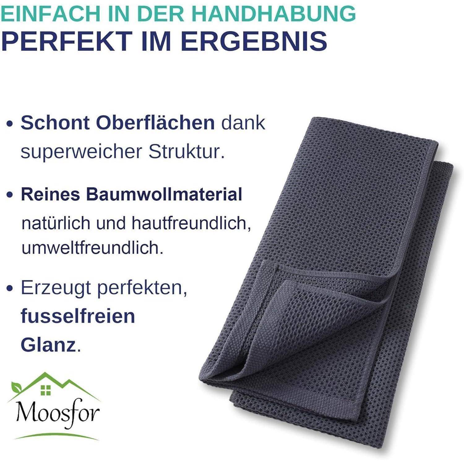 Dunkler strukturierter Stoff, der sanfte Pflege von Oberflächen fördert. Merkmale umfassen weiche Struktur, reine Baumwolle, umweltfreundlich, fusselfreier Glanz. Firmenlogo 'Moosfreund' mit grünen Elementen.