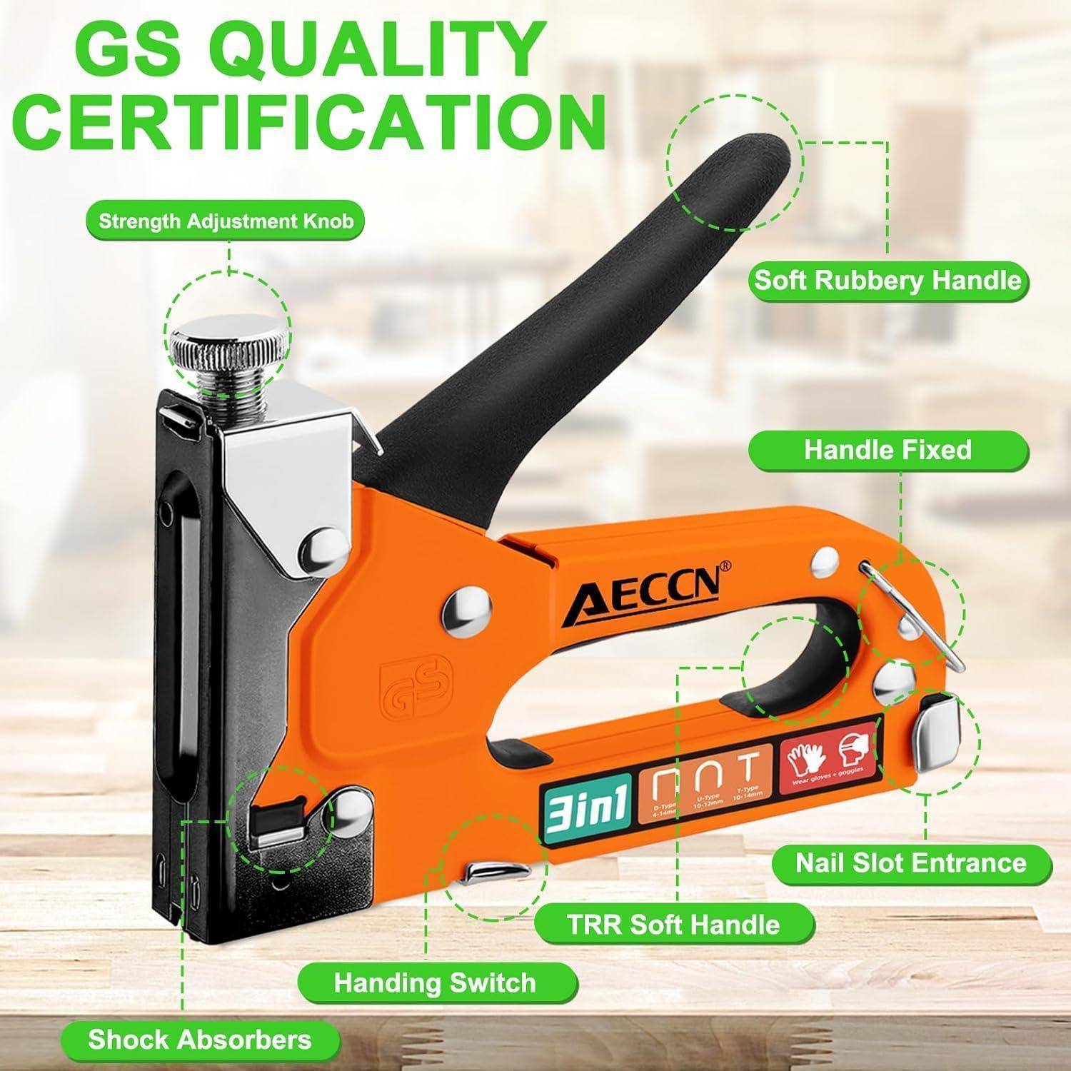 Heller orangefarbener Hefter mit 'GS-Qualitätszertifikat'-Etikett. Zu den Merkmalen gehören ein weicher, gummierter Griff, ein Stärkeanpassungsknopf und Stoßdämpfer.