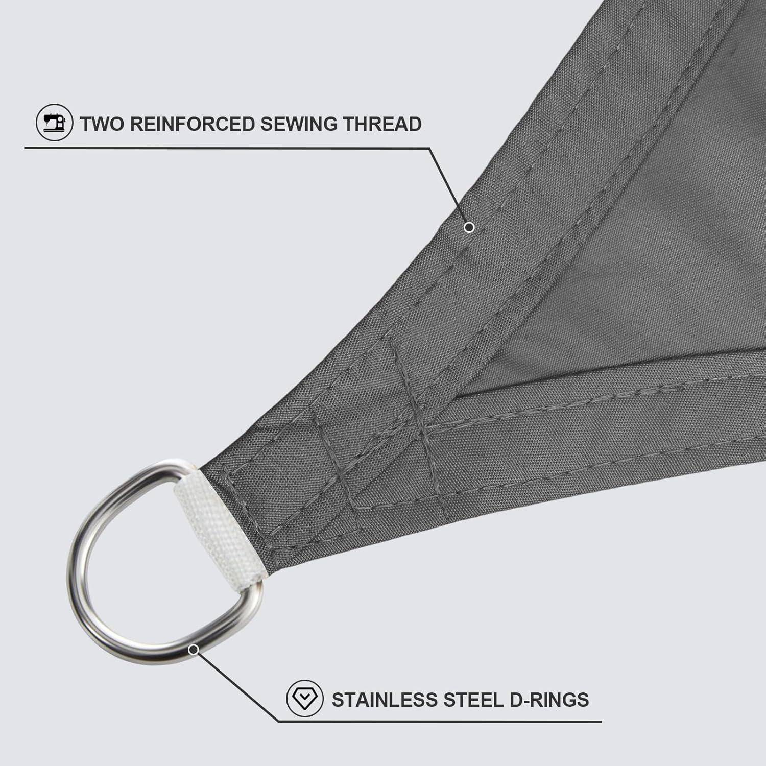 Nahaufnahme einer grauen Segelecke mit verstärkter Nähgarn-Naht und Edelstahl-D-Ring, die Haltbarkeit und Design hervorheben.