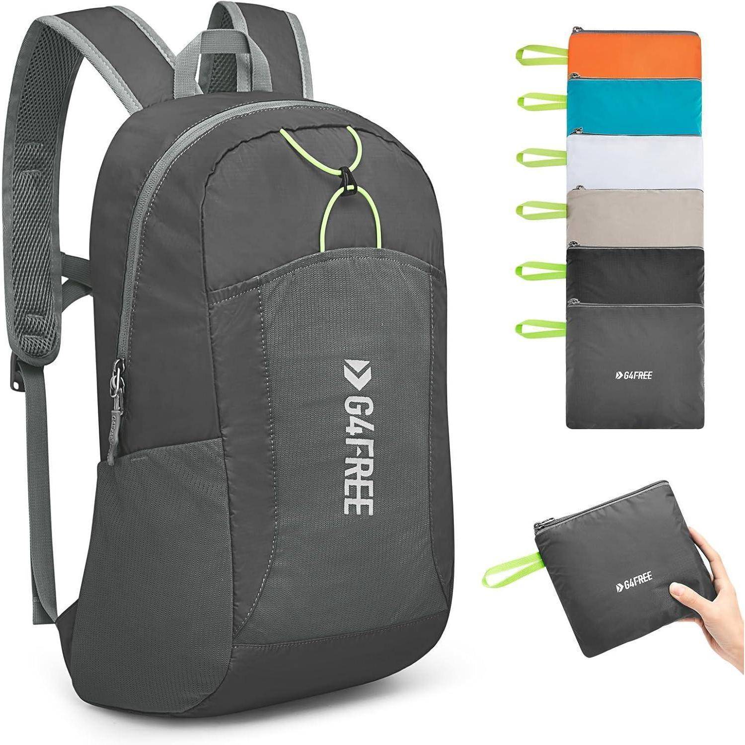 Ein grauer Rucksack mit einer Vordertasche, der mit 'G4FREE' markiert ist. Sechs kompakte, faltbare Taschen sind zu sehen, die ihre Transportfähigkeit unterstreichen.