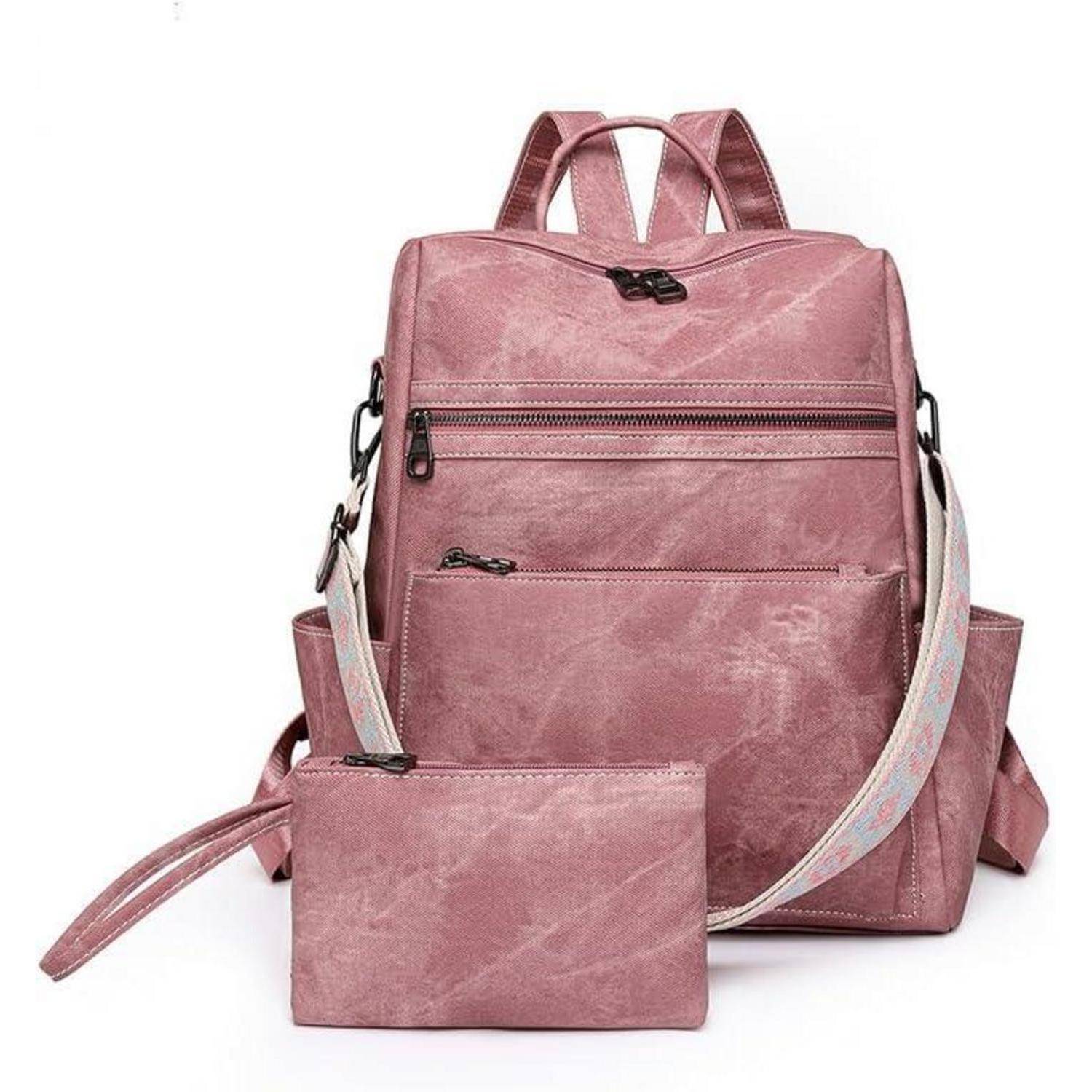 Ein rosa Rucksack-Set, bestehend aus einem größeren Rucksack mit mehreren Reißverschlüssen und einer kleineren, passenden Tasche vorne.