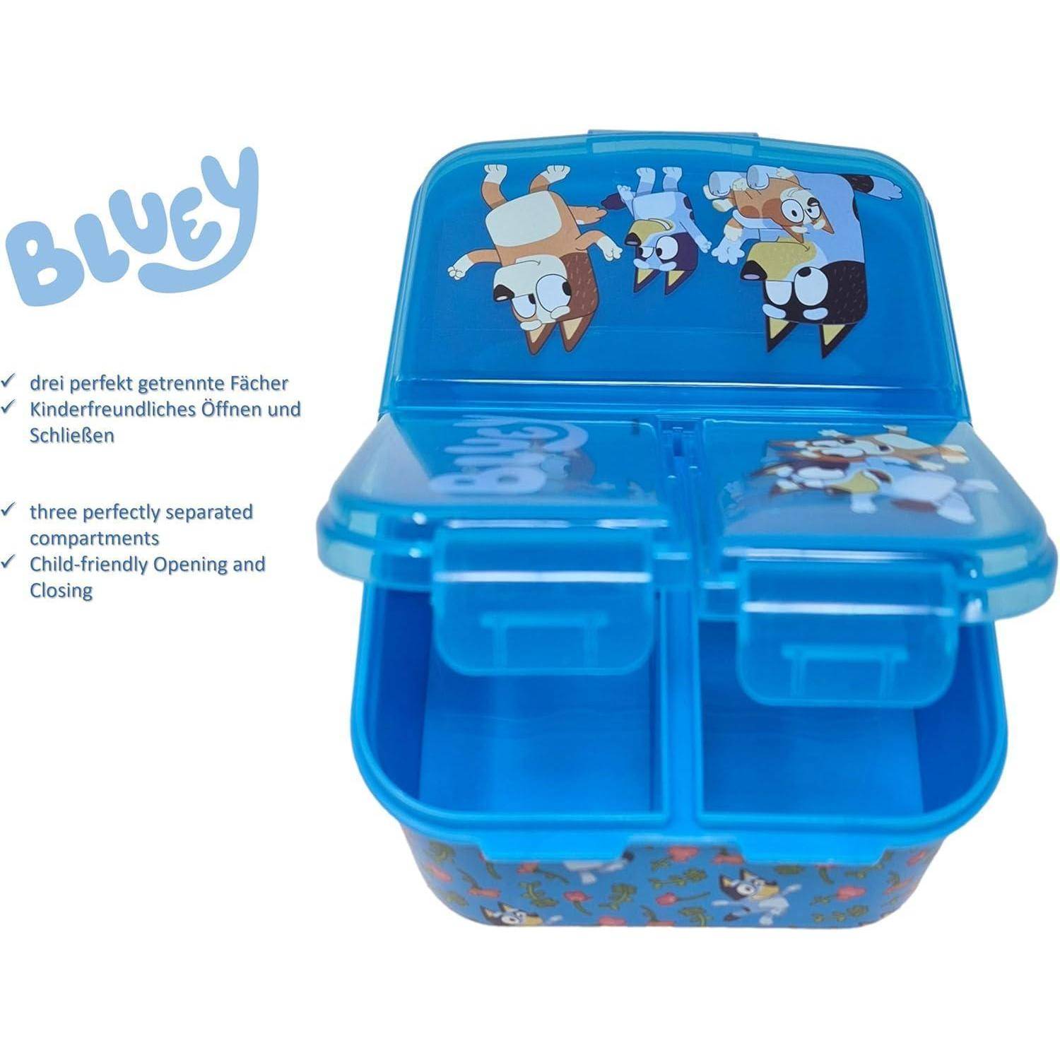 Blaue Lunchbox mit drei Fächern, mit Cartoon-Hunden auf dem Deckel. Text lautet: 