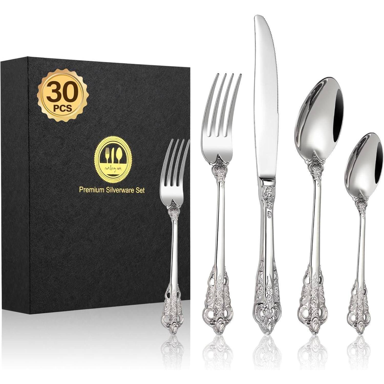 Ein Premium-Silberbesteck-Set mit kunstvoll verzierten Griffen, präsentiert neben einer schwarzen Box mit der Aufschrift „30-teiliges Premium-Silberbesteck-Set