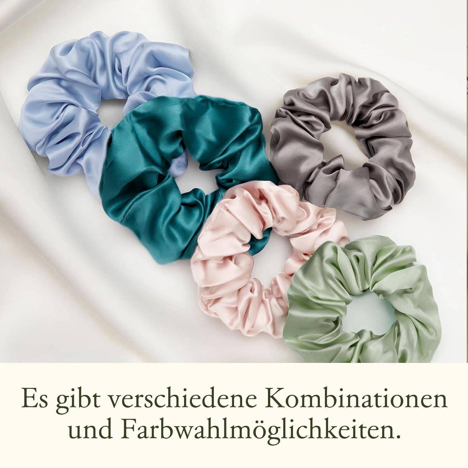 Vier bunte Haargummis in Blau, Grün, Pink und Grau sind in einem Halbkreis angeordnet. Text auf Deutsch bespricht Farboptionen.