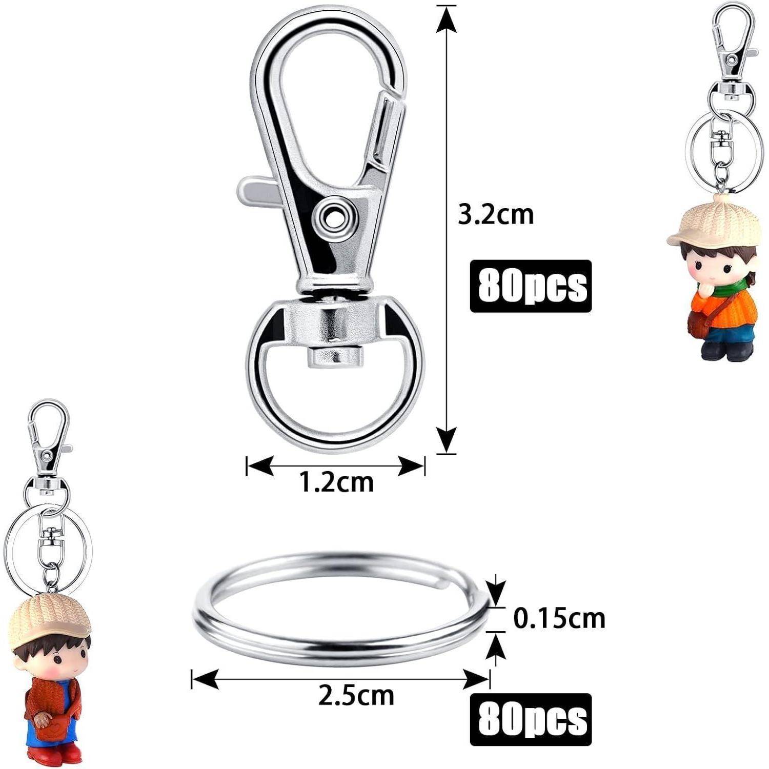 Schlüsselanhänger-Set mit Klappverschlussmechanismus und abnehmbarem Ring; umfasst 80 Stück. Enthält einen Schlüsselanhänger mit Comicfigur. Maße angegeben.