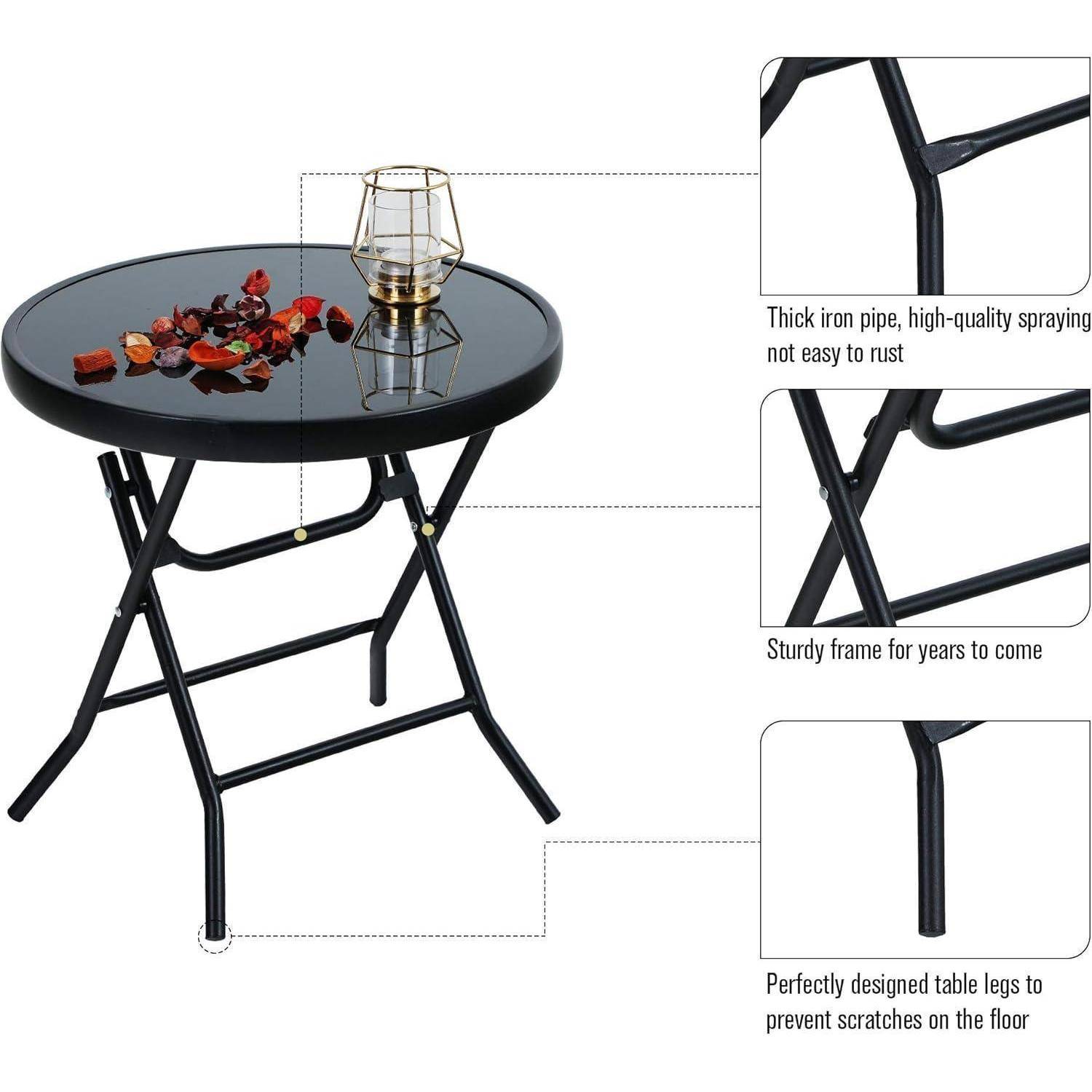Ein runder, schwarzer Klapptisch mit robusten Eisenbeinen, ausgestattet mit einer Glasplatte und dekorativen Elementen. Hervorgehobene Merkmale sind kratzfeste Beine und rostbeständiges Material.