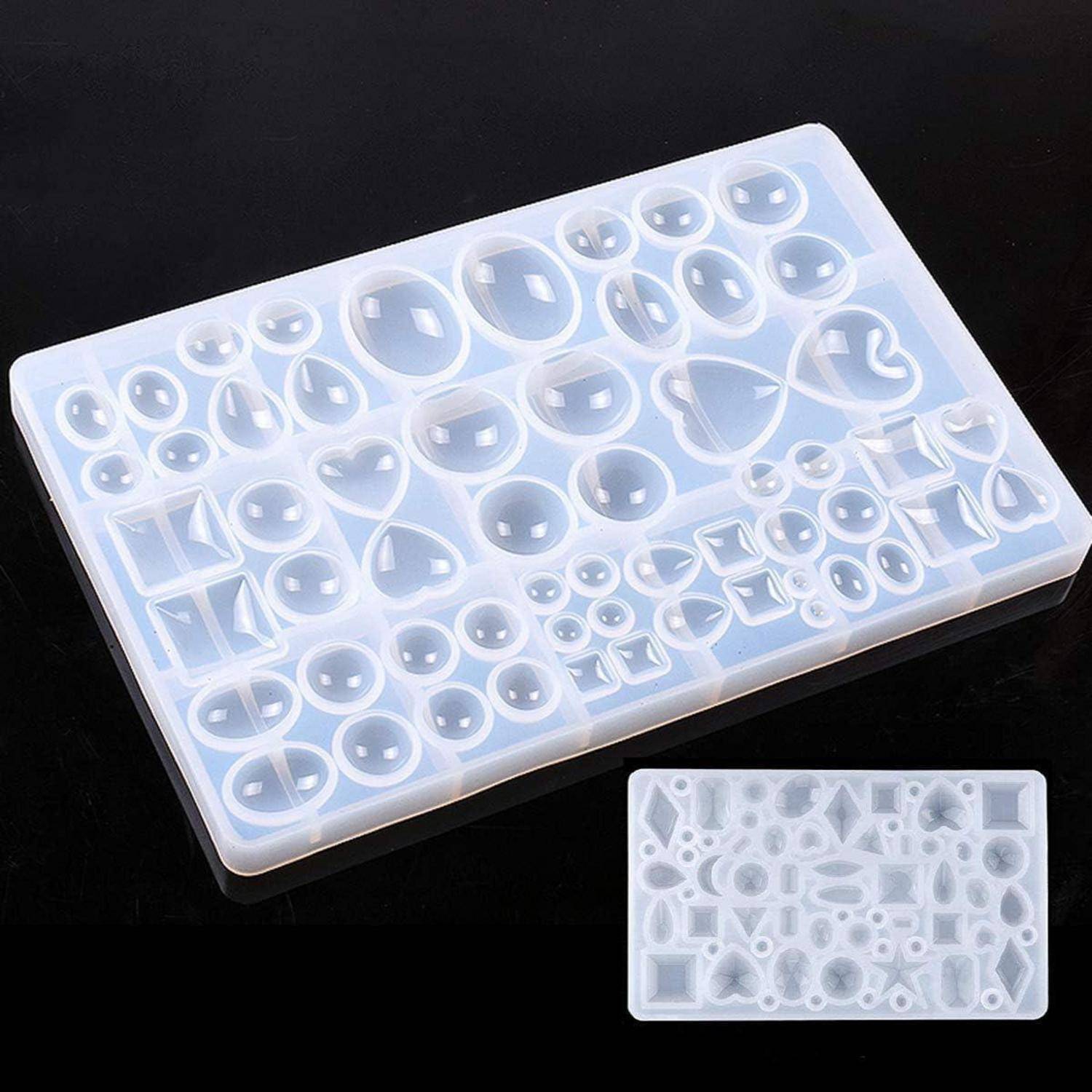 Silikonform-Tablett mit verschiedenen geometrischen Formen für Bastelarbeiten, auf einer schwarzen Oberfläche präsentiert.