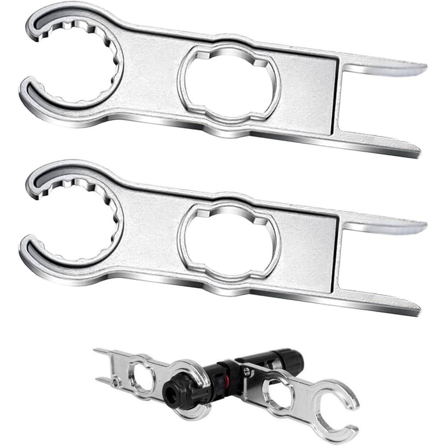 Zwei silberne Fahrrad-Tretlager-Schraubenschlüssel und ein Werkzeug zum Halten des Tretlagers eines Fahrrads, verwendet für Wartung und Installation.