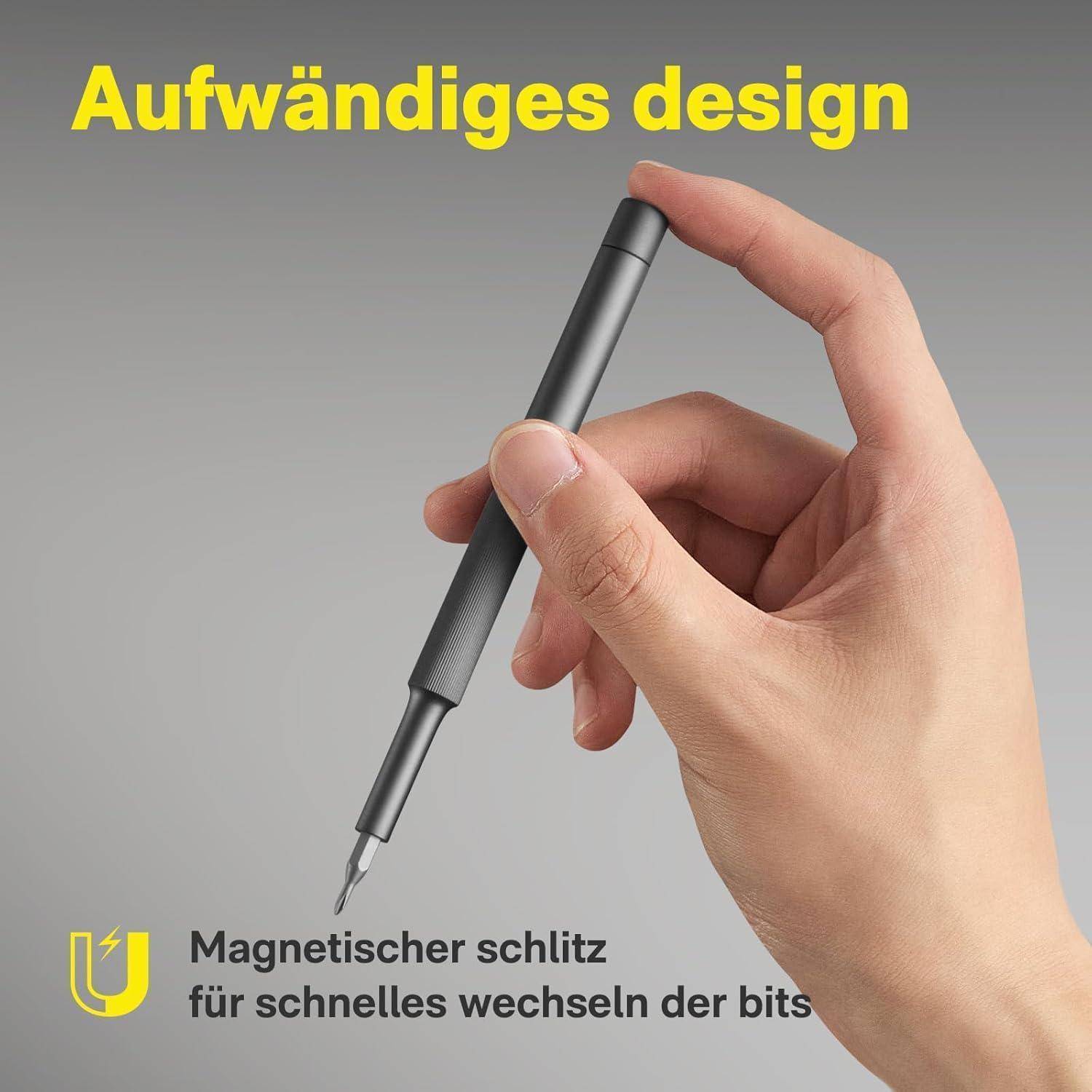 Eine Hand, die einen eleganten Schraubendreher hält, mit Fokus auf dem magnetischen Schlitz, betont durch den deutschen Text 