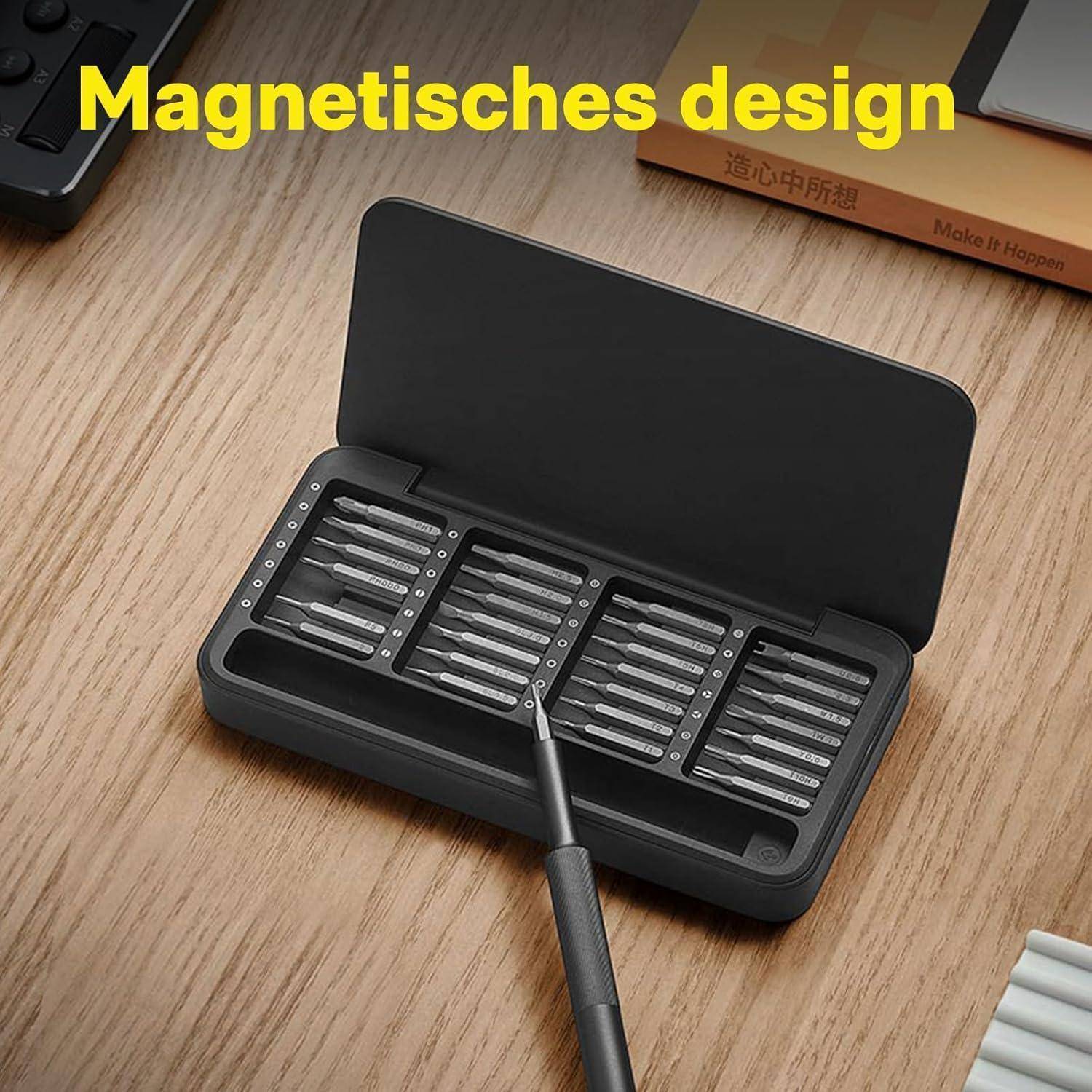 Metallschraubendreher-Set mit mehreren Bits in einem magnetischen Etui, mit der Beschriftung 'Magnetisches Design', was die Betonung der magnetischen Eigenschaften impliziert.