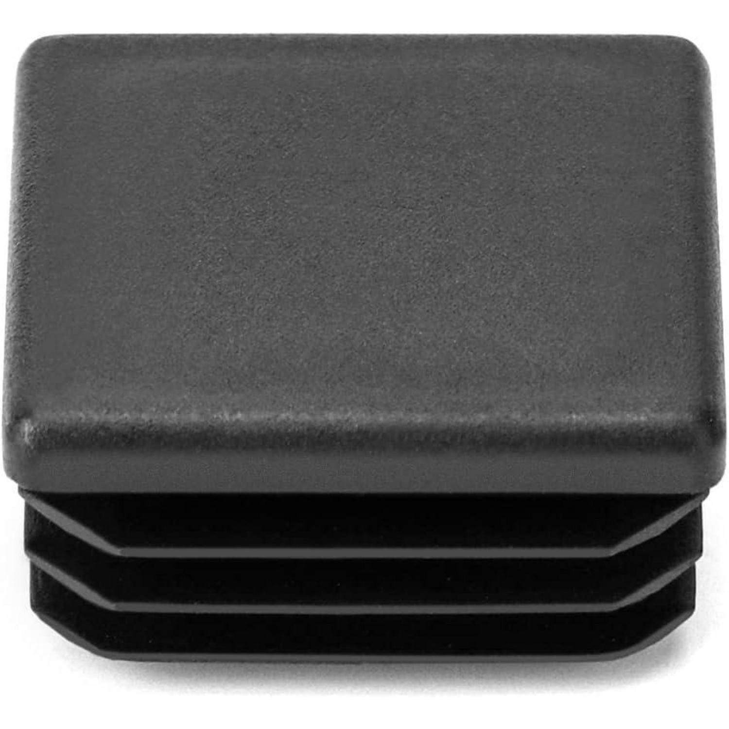 Eine quadratische schwarze Plastikkappe mit gerillten Seiten, die zum Abdichten oder Verschließen von röhrenförmigen Strukturen oder Enden konzipiert ist.