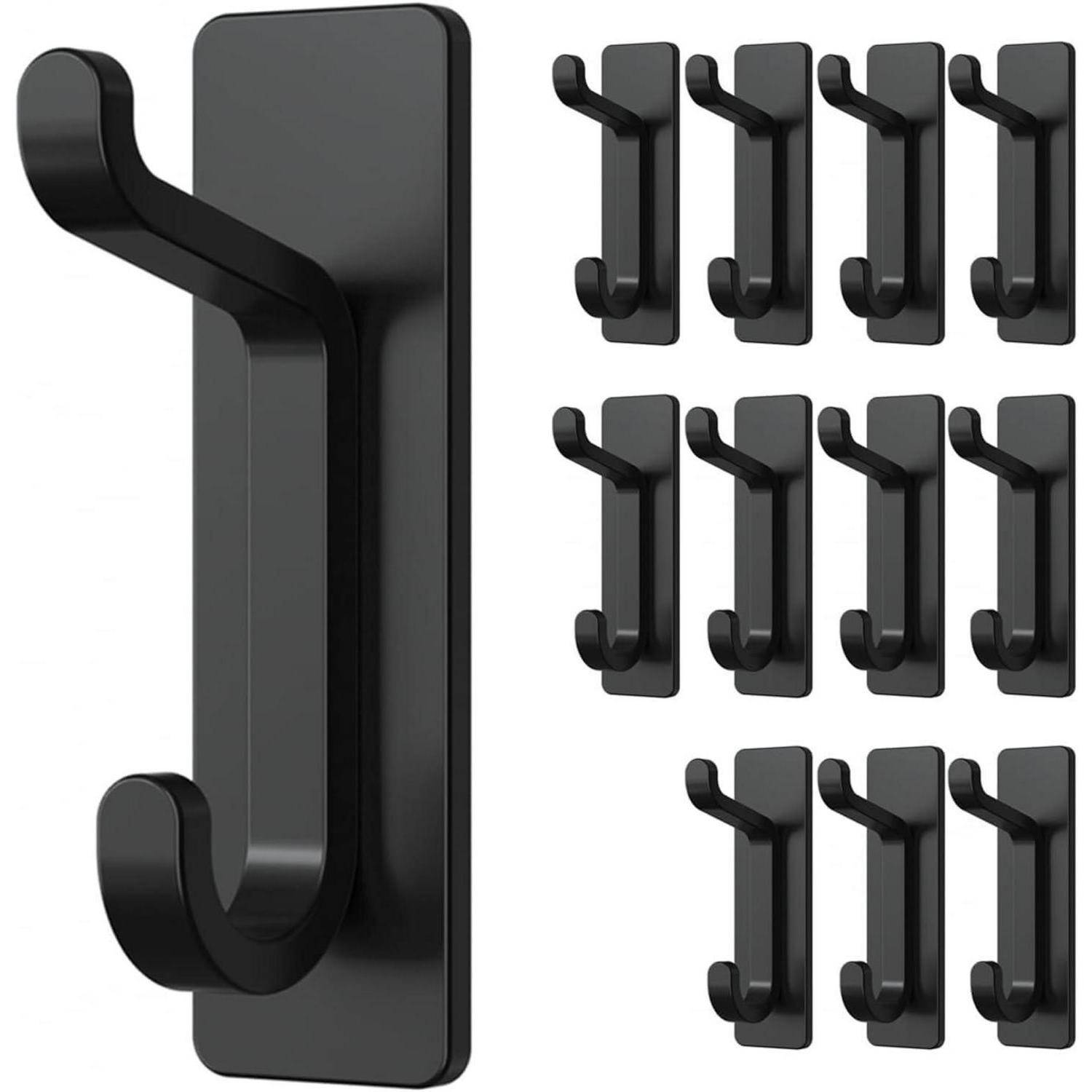 Satz von 12 schwarzen selbstklebenden Wandhaken. Jeder Haken hat ein schlankes, geschwungenes Design zum Aufhängen von Gegenständen wie Handtüchern oder Mänteln.
