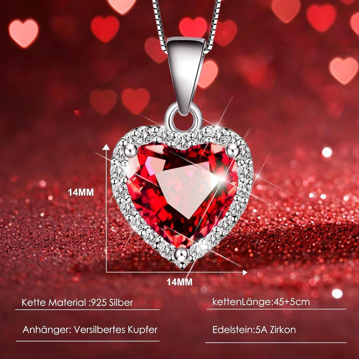 Eine herzförmige rote Edelsteinkette, umgeben von kleinen klaren Steinen, Maße: 14mm, Kettenlänge: 45+5cm, Materialien: 925er Silber, Kupfer, Zirkon.