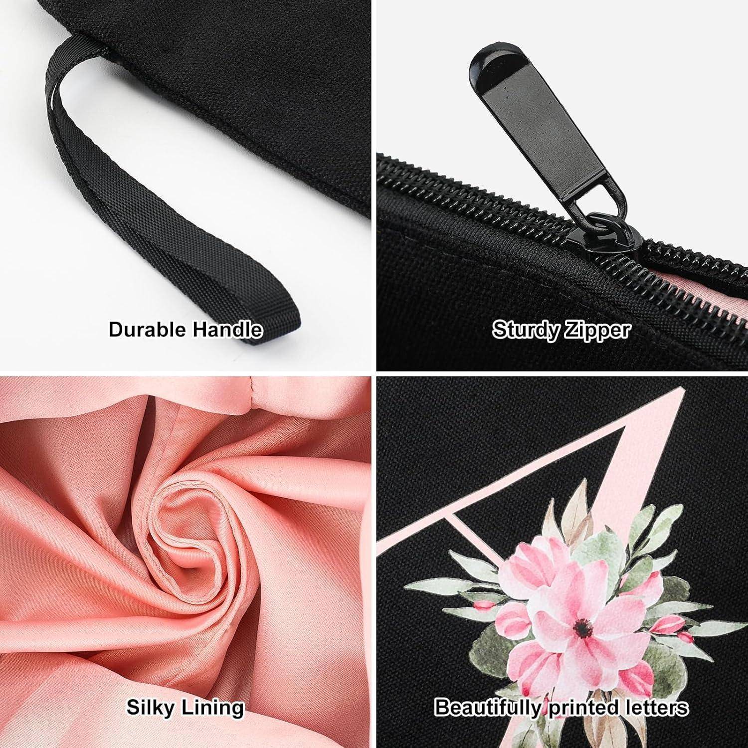 Haltbarer Griff, robuster Reißverschluss, seidiger Futterstoff, schön gedruckte Buchstaben mit pinker Blumendesign auf schwarzem Stoff.