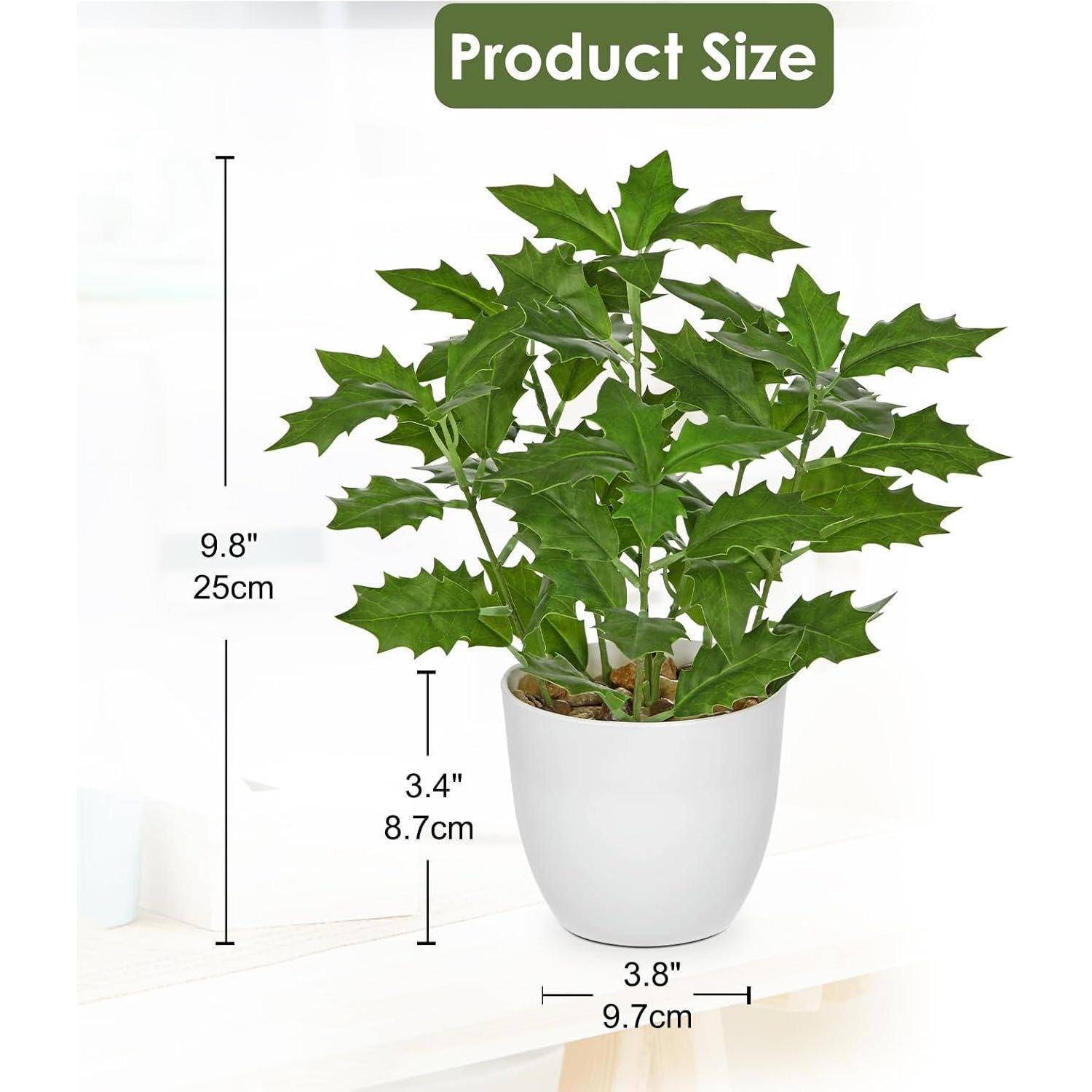 Eine künstliche grüne Pflanze in einem weißen Topf, mit Etikett 'Produktgröße'. Die Pflanze ist 9,8 Zoll (25 cm) hoch, der Topf ist 3,4 Zoll (8,7 cm) hoch und 3,8 Zoll (9,7 cm) breit.