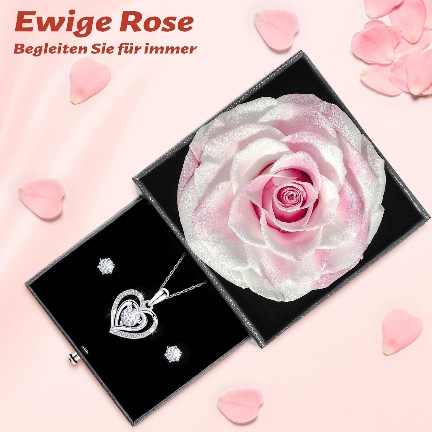 Ein Schmuckset bestehend aus einer herzförmigen Halskette und Ohrringe, die neben einer großen rosa Rose platziert sind. Deutscher Text lautet: „Ewige Rose, Begleiten Sie für immer.