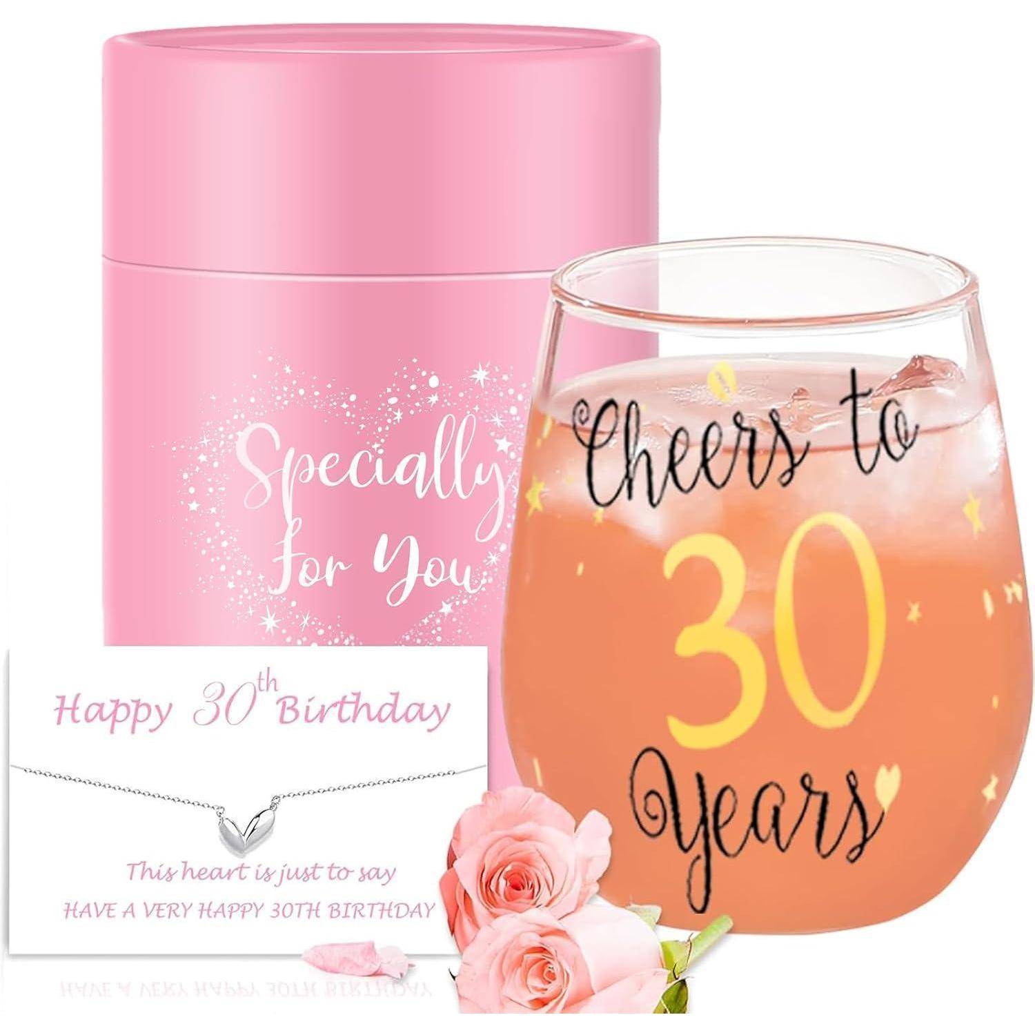 Rosa zylindrische Geschenkbox mit 'Speziell für Dich', eine Karte mit der Aufschrift 'Herzlichen Glückwunsch zum 30. Geburtstag', und ein rosa Trinkglas mit 'Prost auf 30 Jahre'.
