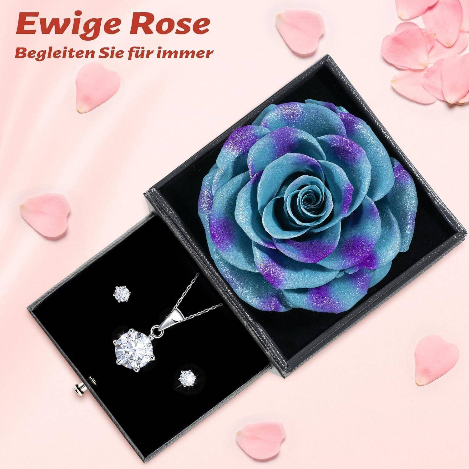 Eine blaue und lila konservierte Rose in einer schwarzen Box, mit einer Halskette und Ohrringen, die darunter ausgestellt sind. Deutscher Text lautet: 'Ewige Rose: Begleiten Sie für immer'.