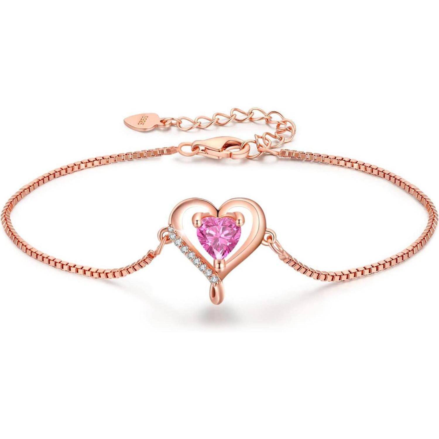 Ein Roségold-Armband mit einem herzförmigen Design, versehen mit einem pinken Edelstein und kleinen Diamanten, gefasst auf einer zarten Kette.