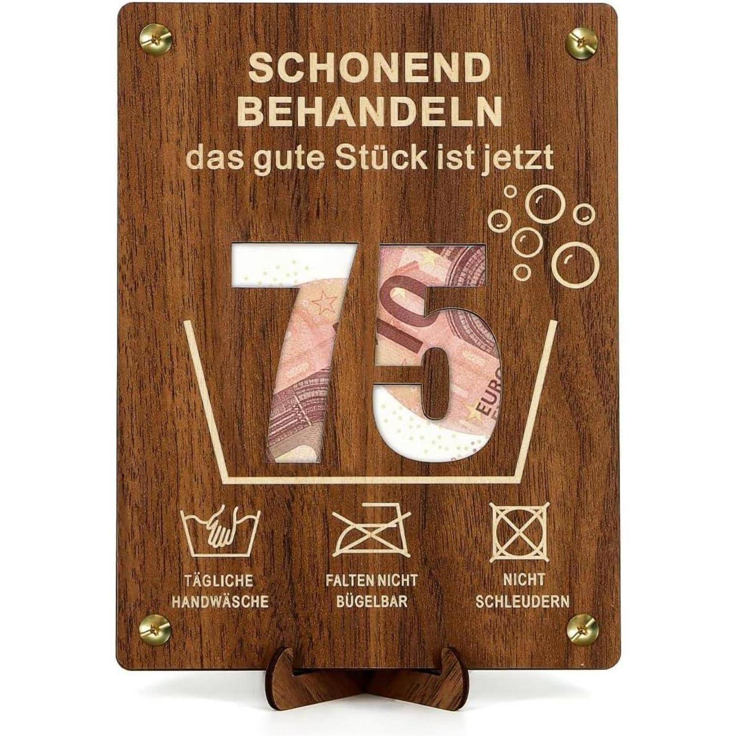 75' Euro-Notensymbol auf Holz, umgeben von Wäschesymbolen. Text: 'Schonend behandeln das gute Stück ist jetzt.