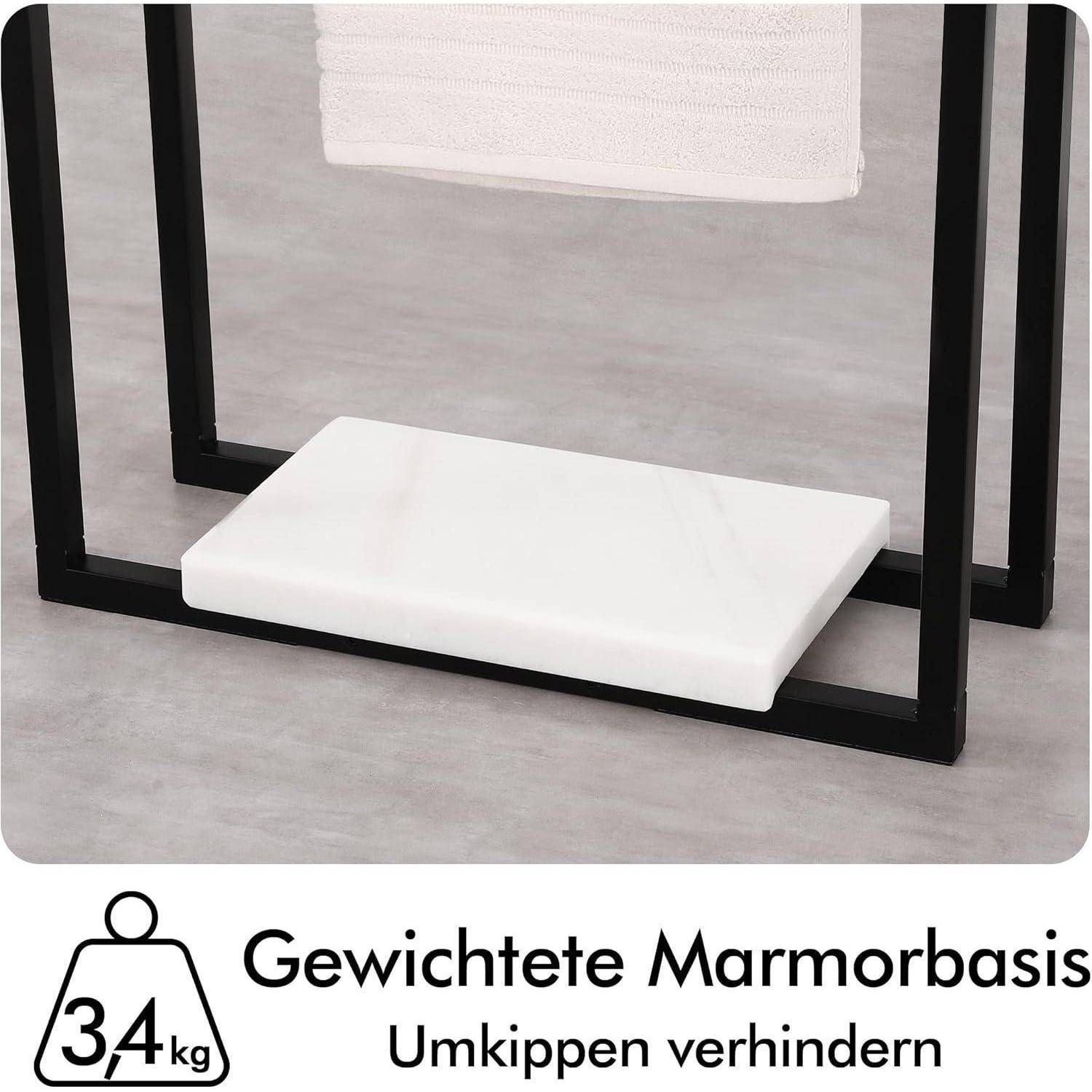 Ein freistehender Handtuchhalter mit einer gewichteten Marmorbasis, beschriftet mit '3,4 kg Gewichtete Marmorbasis Umkippen verhindern' zur Stabilität.