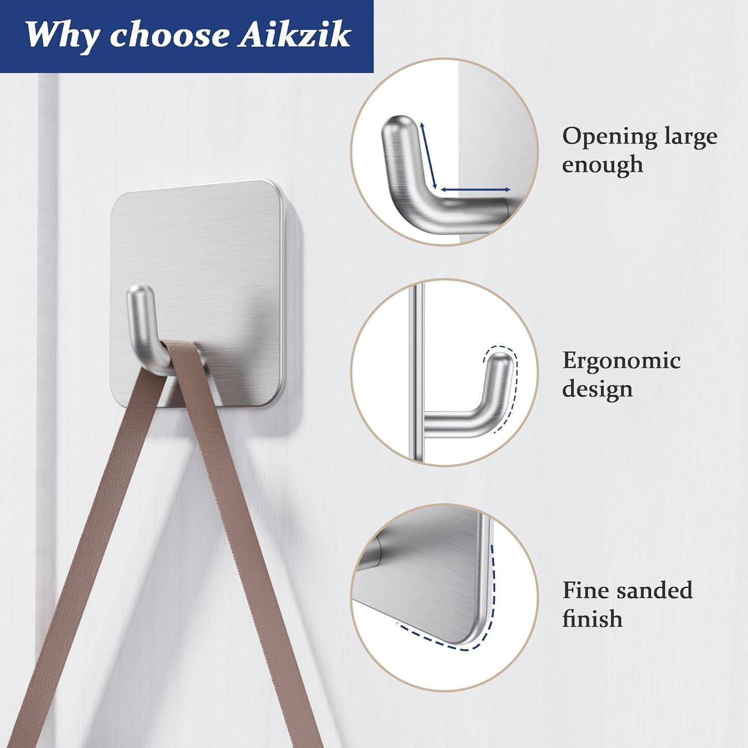 Ein Wandhaken aus Edelstahl, der zwei Riemen trägt. Drei kreisförmige Einblendungen heben Merkmale hervor: große Öffnung, ergonomisches Design, fein geschliffene Oberfläche. Text: ‚Warum Aikzik wählen'.