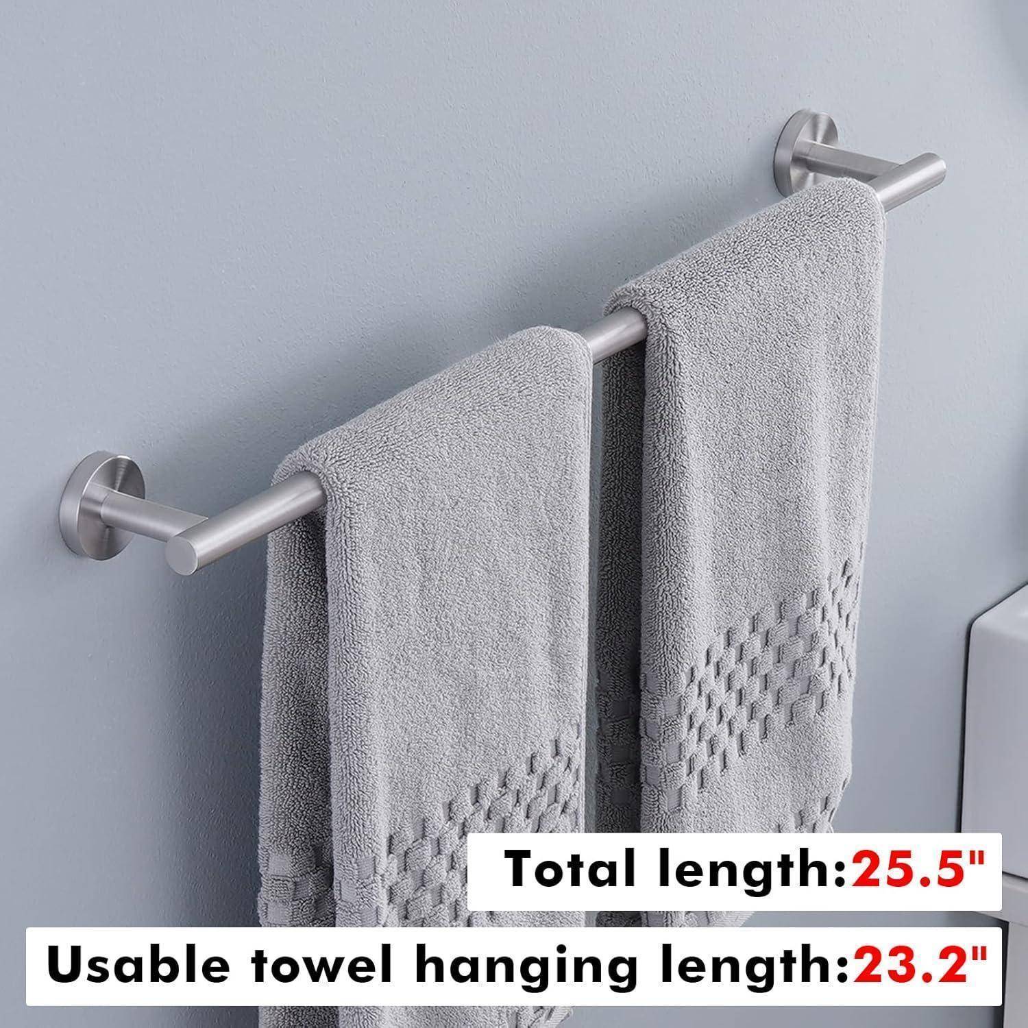 Handtuchhalter an einer grauen Wand mit zwei Handtüchern. Text liest sich: 'Gesamtlänge: 25,5