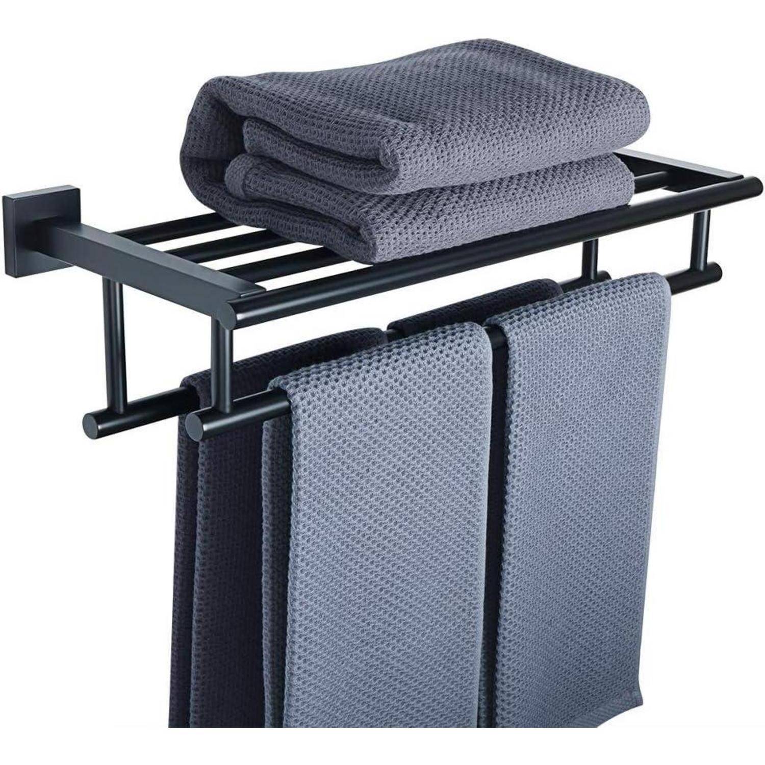Ein schwarzes Metallhandtuchhalter hält zwei dunkelblau hängende Handtücher und zwei gefaltete obenauf.