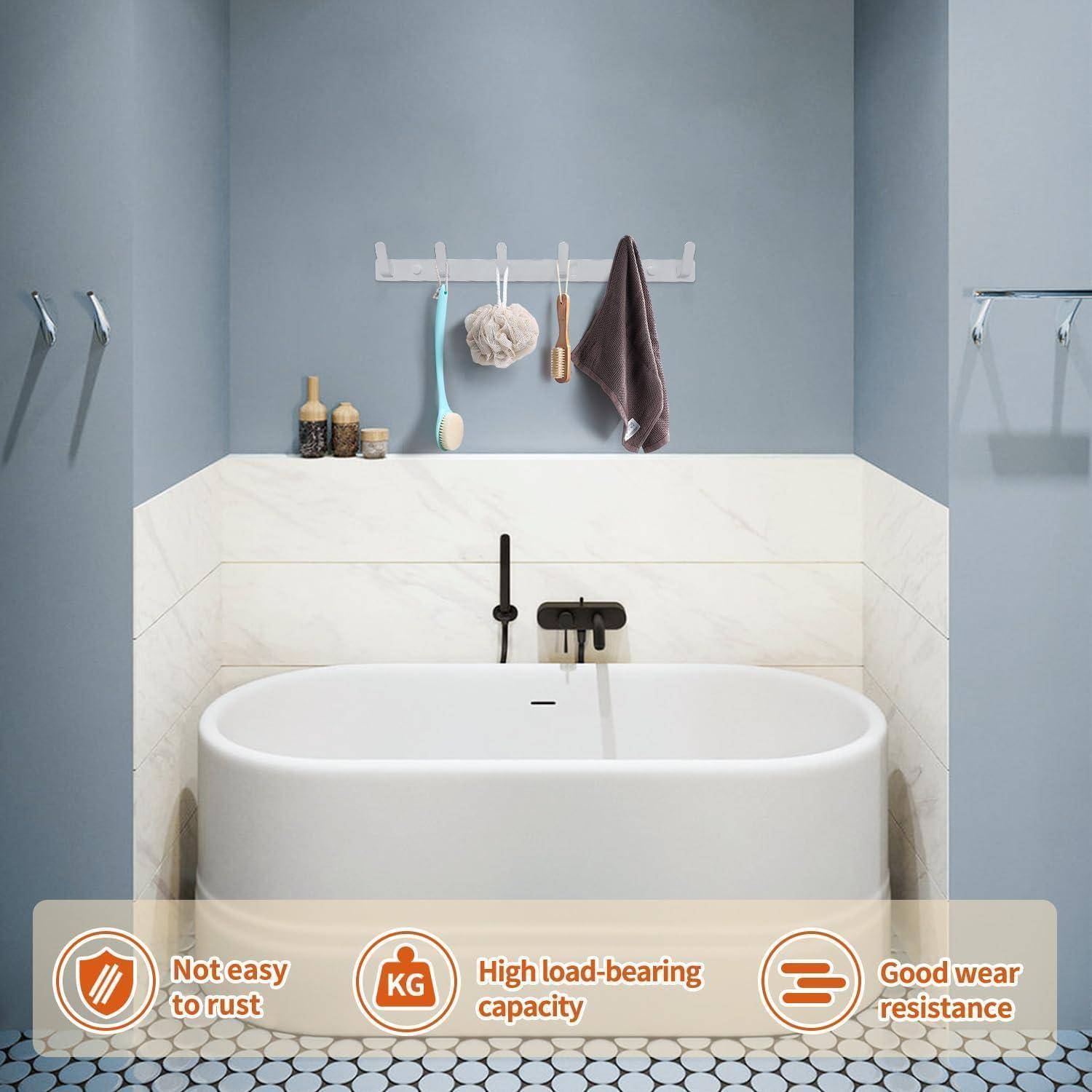 Modernes Badezimmer mit einer weißen Badewanne, hexagonalen Bodenfliesen und drei Wandhaken. Hervorgehobene Merkmale: rostbeständig, hohe Tragfähigkeit, verschleißfest.